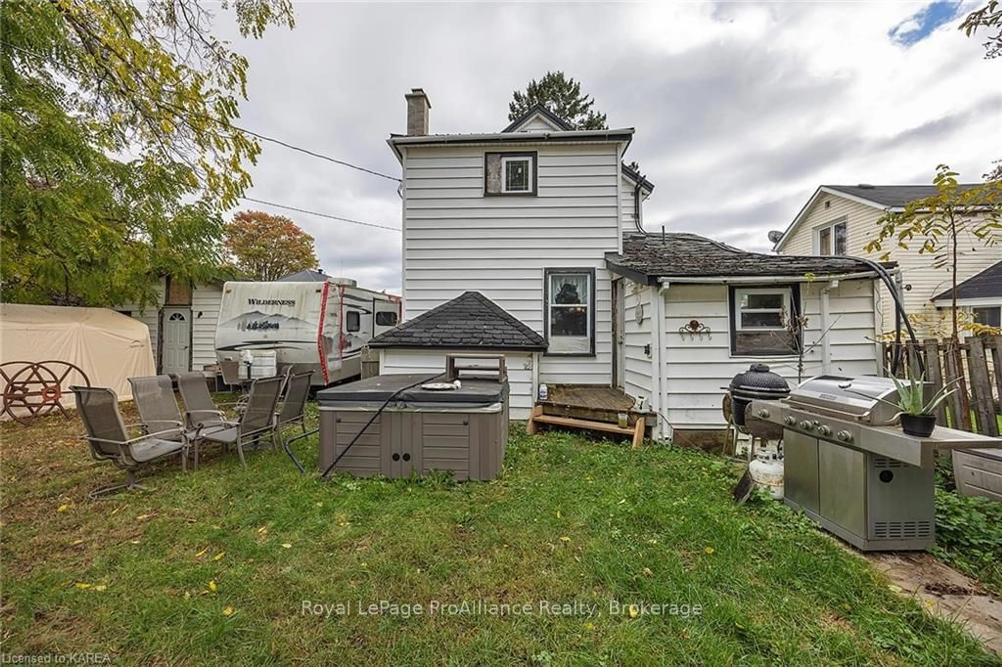 Frontside or backside of a home, the fenced backyard for 308 BROCK St, Gananoque Ontario K7G 1K6