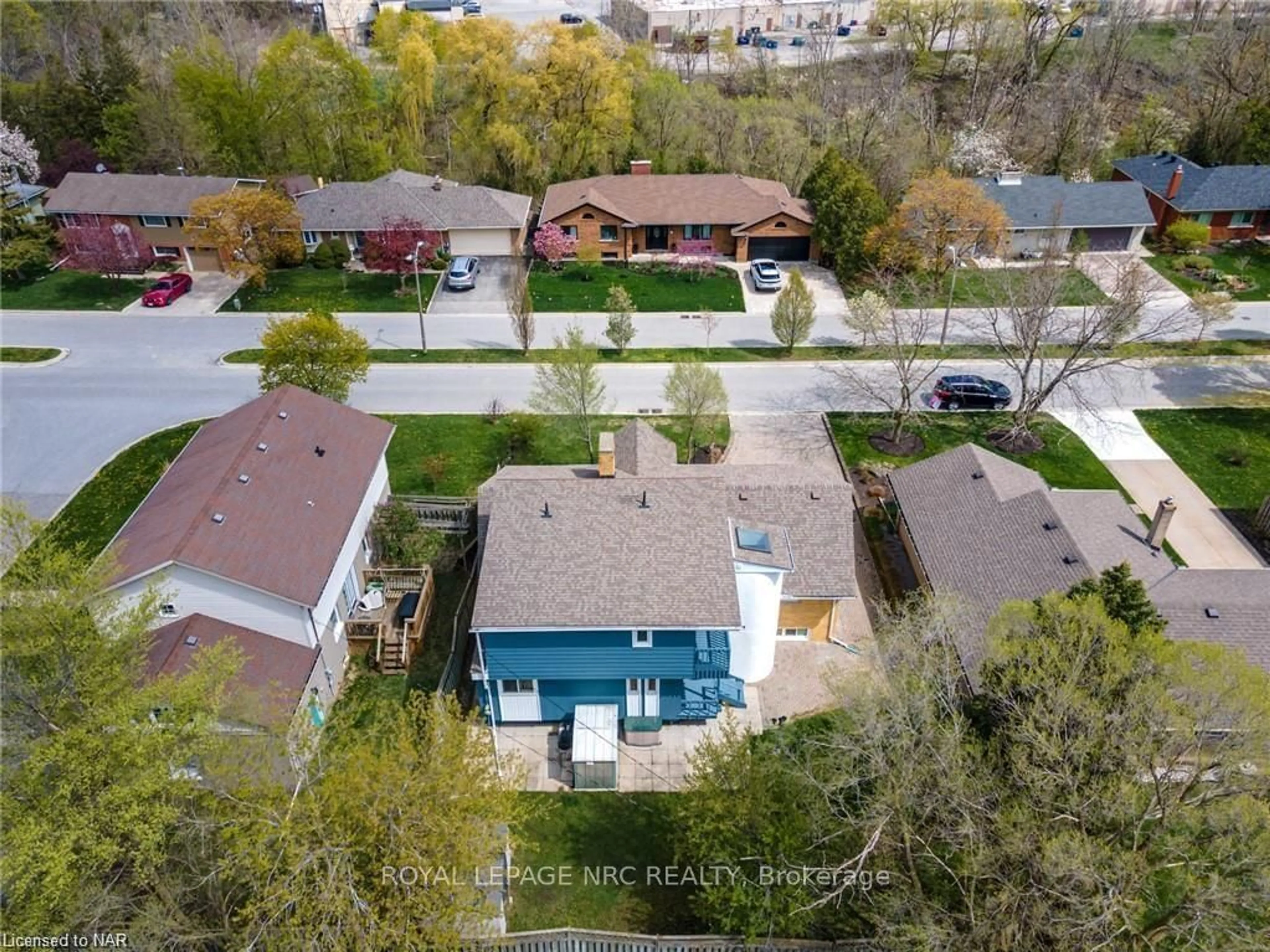 Frontside or backside of a home, the fenced backyard for 24 RIVERVIEW Blvd, St. Catharines Ontario L2T 3L8