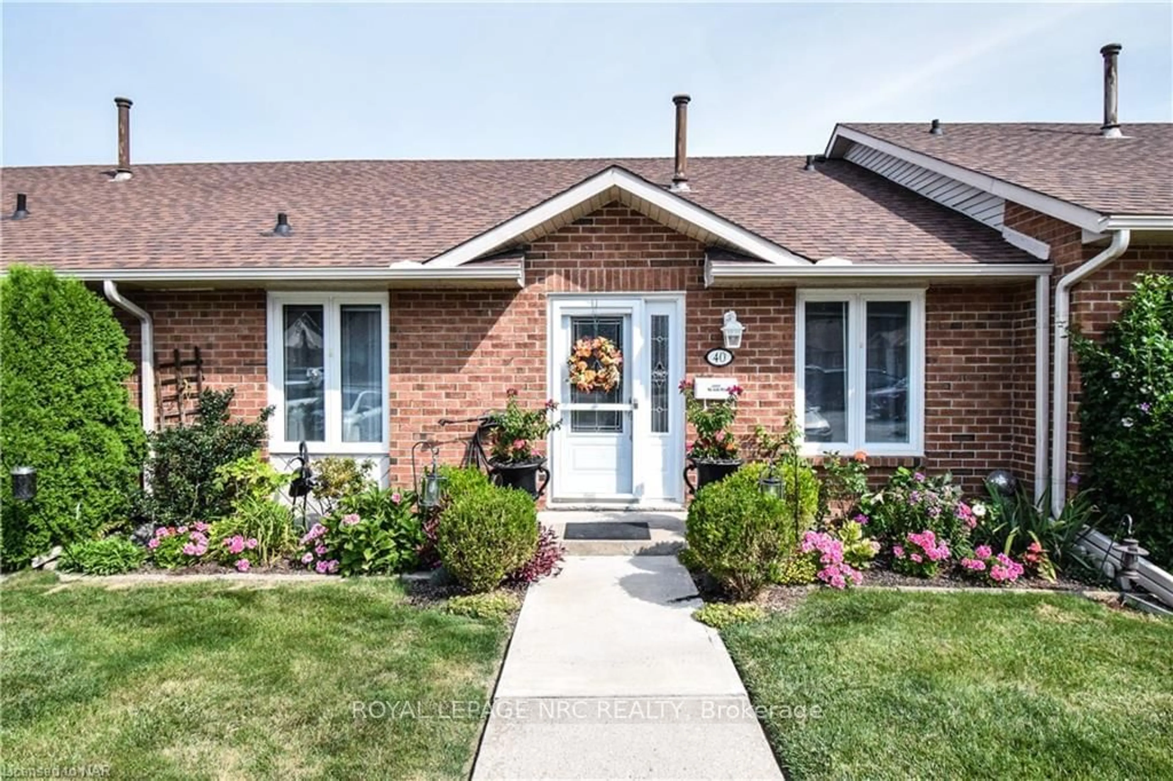 Home with brick exterior material for 122 BUNTING Rd #40, St. Catharines Ontario L2M 3X7