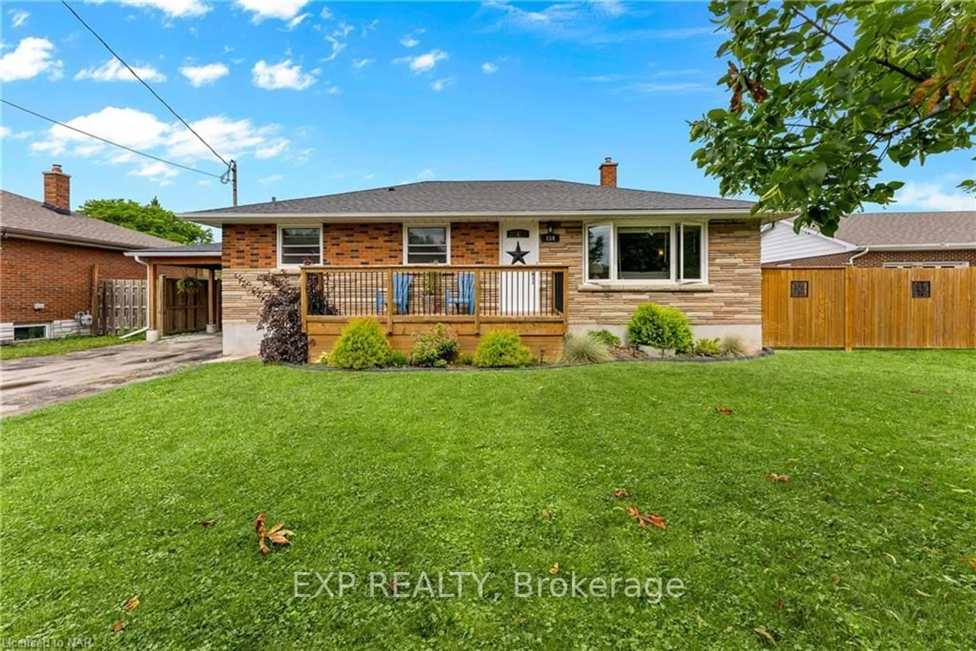 Frontside or backside of a home, the fenced backyard for 114 MARIGOLD St, Welland Ontario L3C 5J9