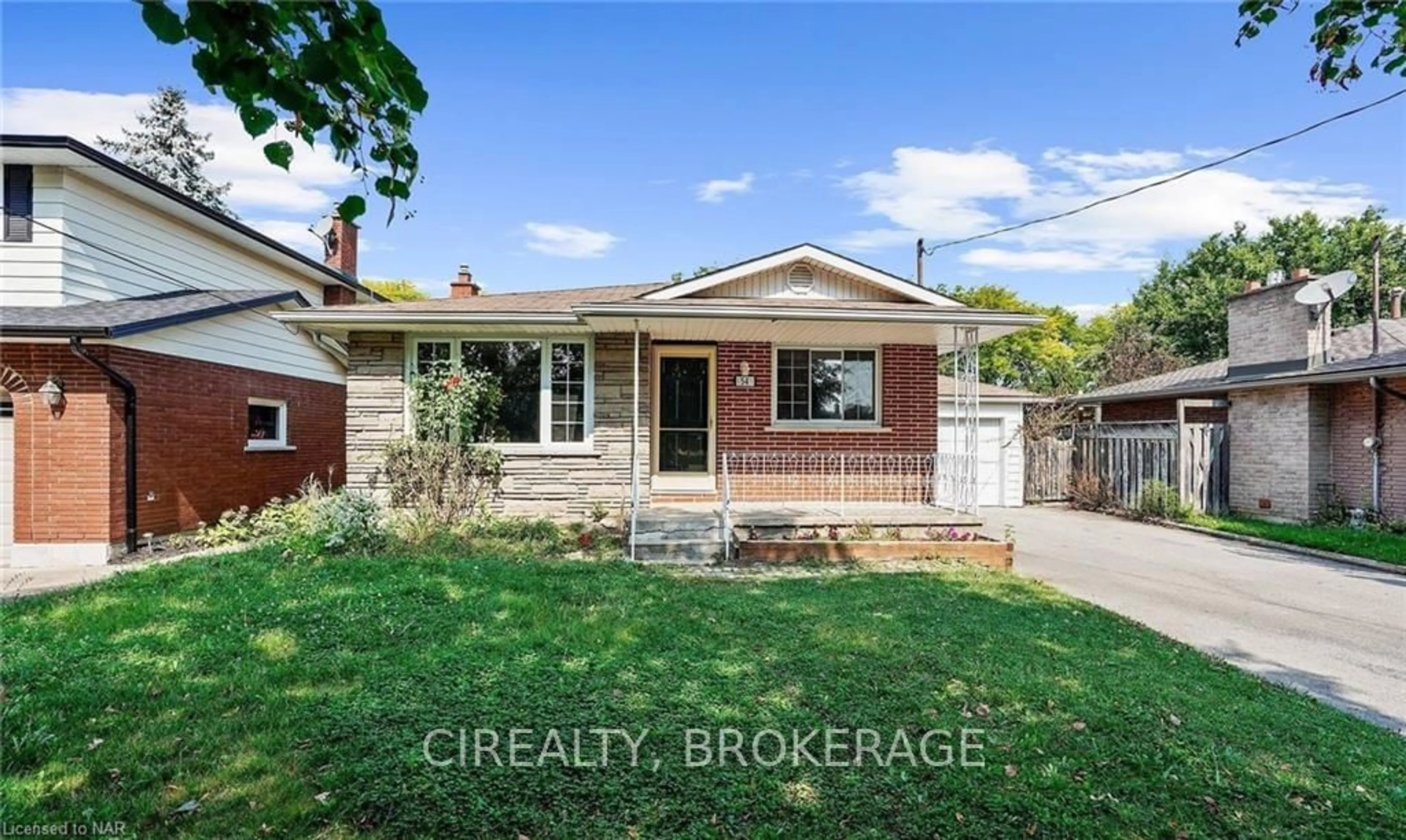 Frontside or backside of a home, the fenced backyard for 54 RAMSEY St, St. Catharines Ontario L2N 2K1