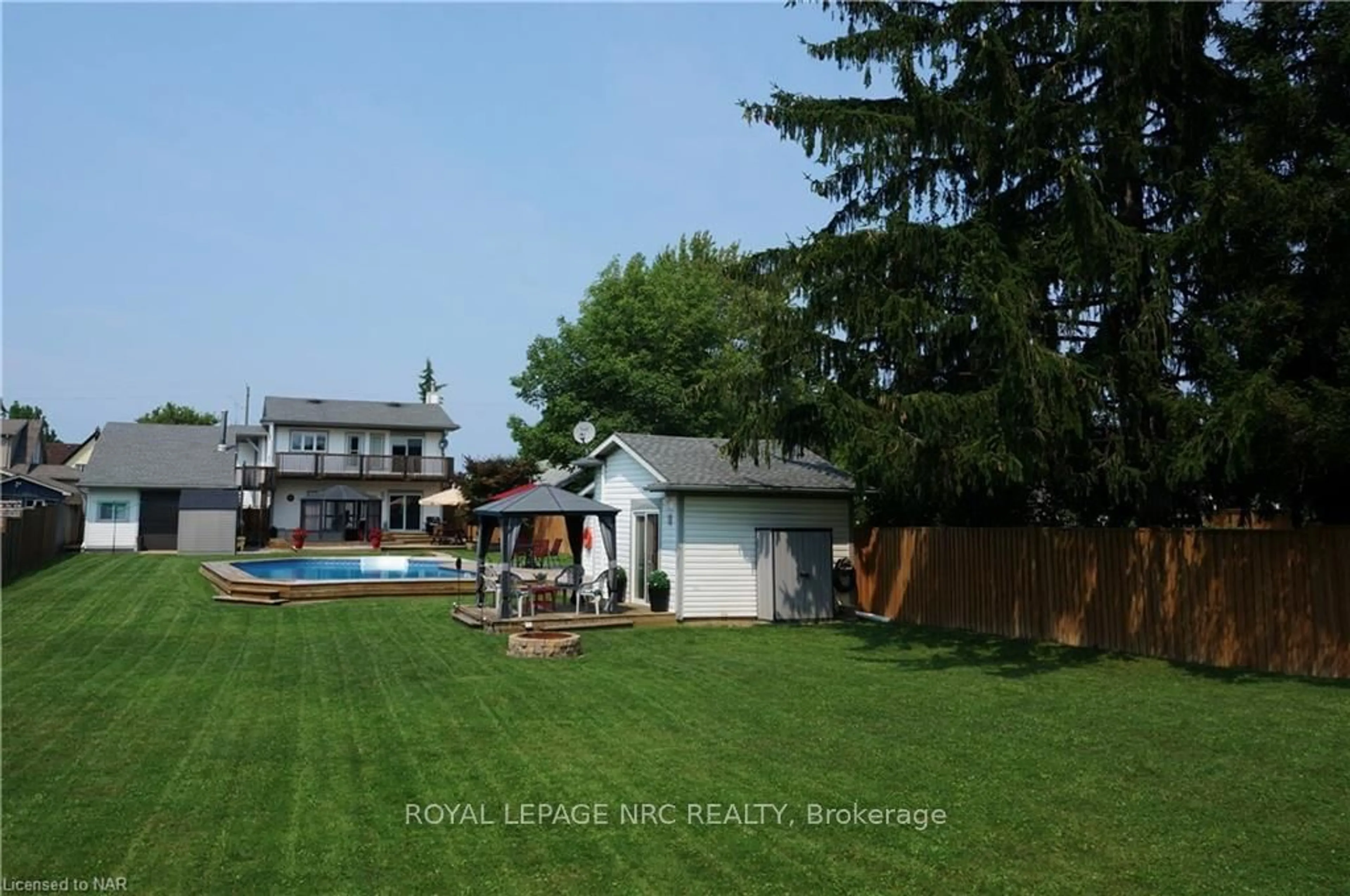 Frontside or backside of a home, the fenced backyard for 62 CECIL St, St. Catharines Ontario L2N 4B2