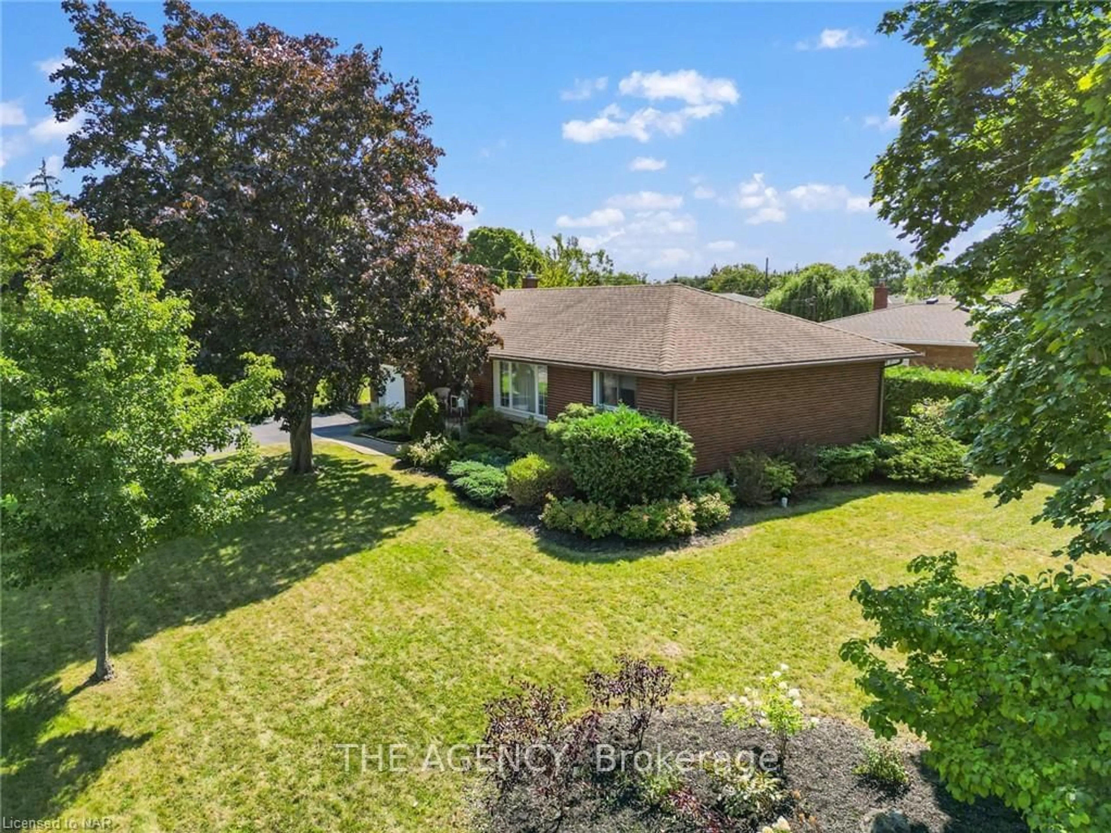 Frontside or backside of a home, the fenced backyard for 4 TAMARACK St, Welland Ontario L3C 4X5