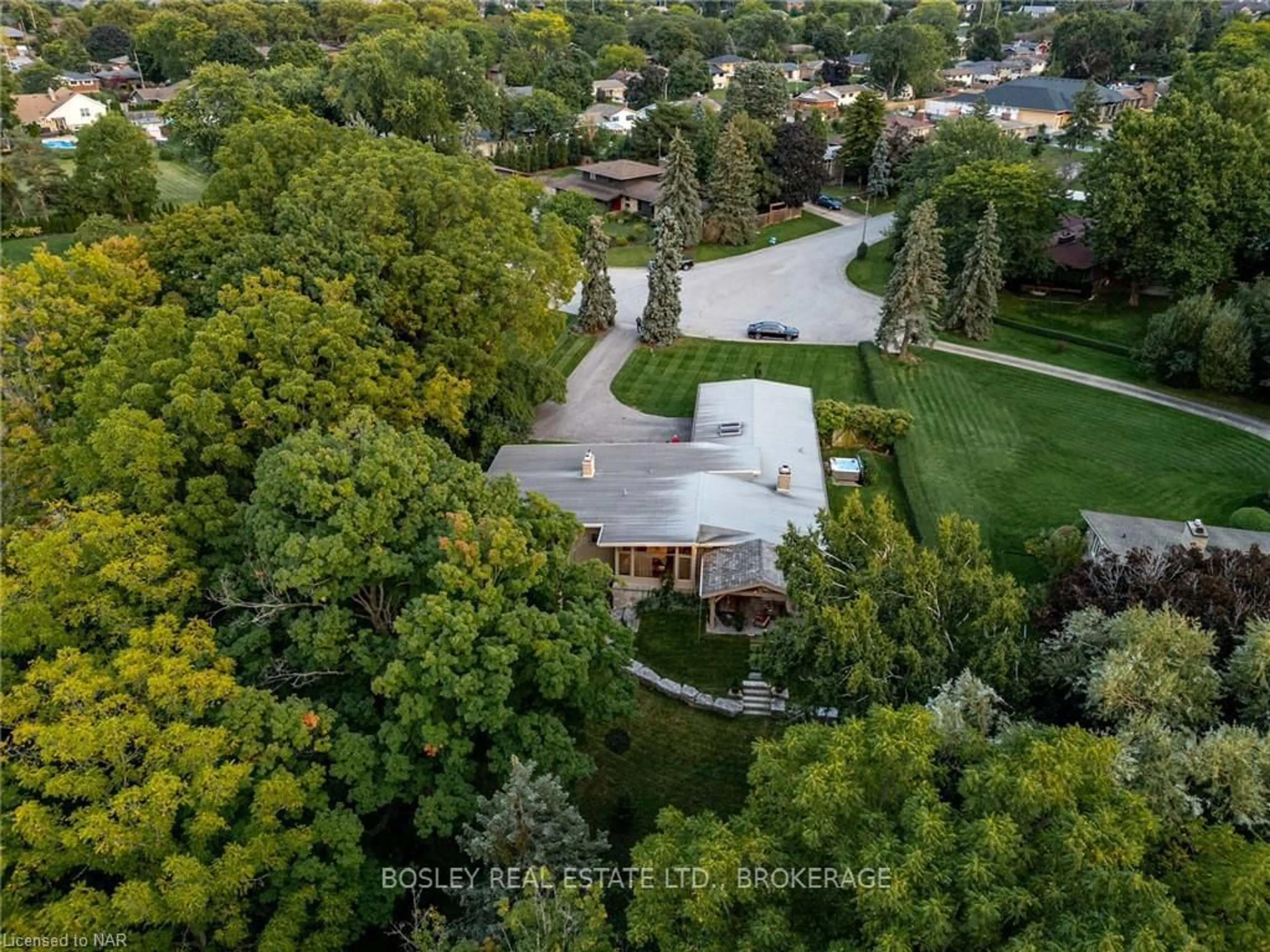 Frontside or backside of a home, the fenced backyard for 21 WOODMOUNT Dr, St. Catharines Ontario L2T 2Y1