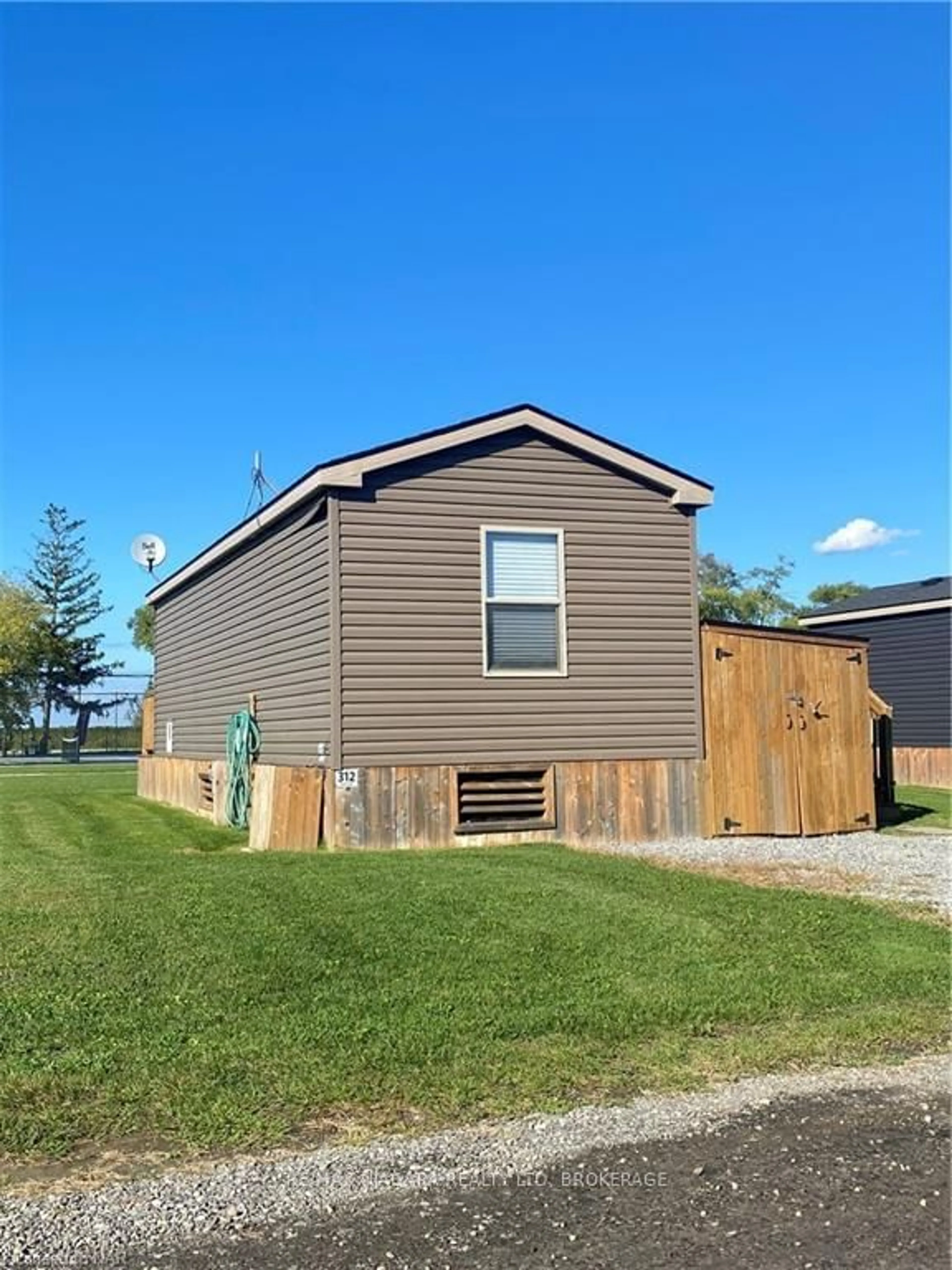 Frontside or backside of a home, the fenced backyard for 1501 LINE 8 Rd #312, Niagara-on-the-Lake Ontario L0S 1J0