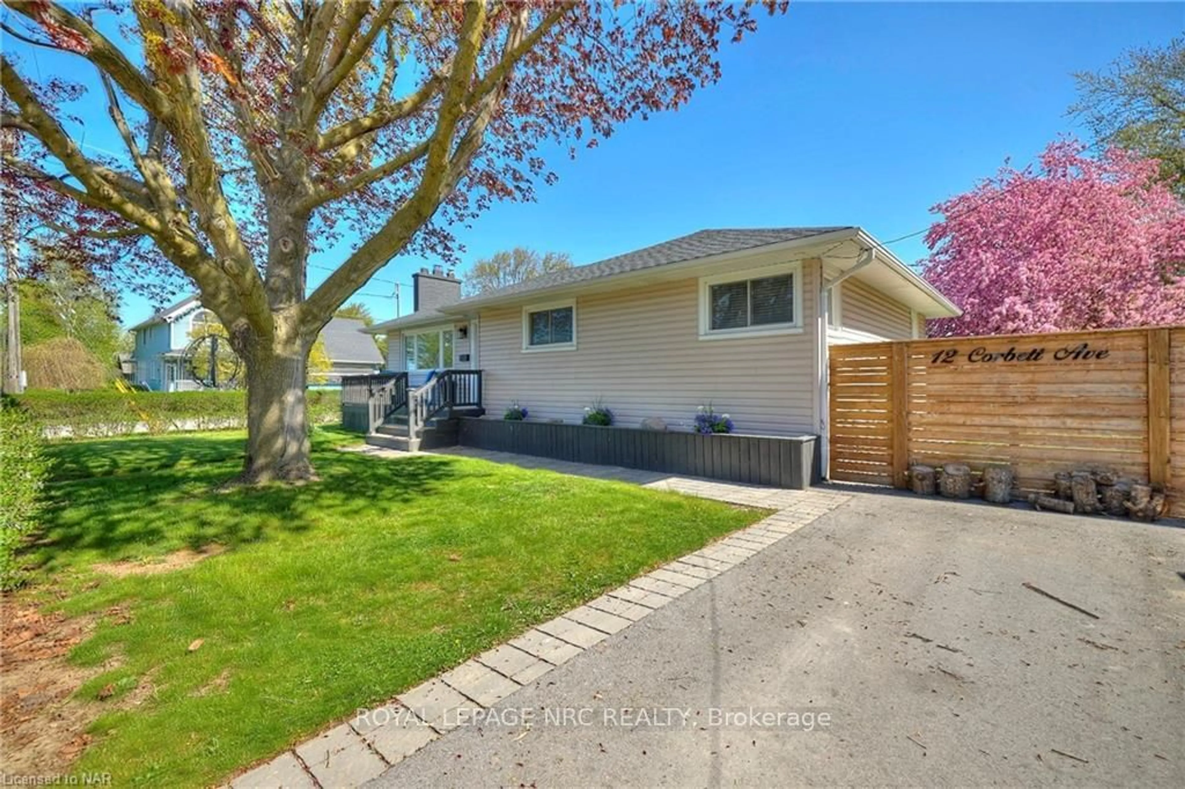 Frontside or backside of a home, the fenced backyard for 12 CORBETT Ave, St. Catharines Ontario L2N 5M5