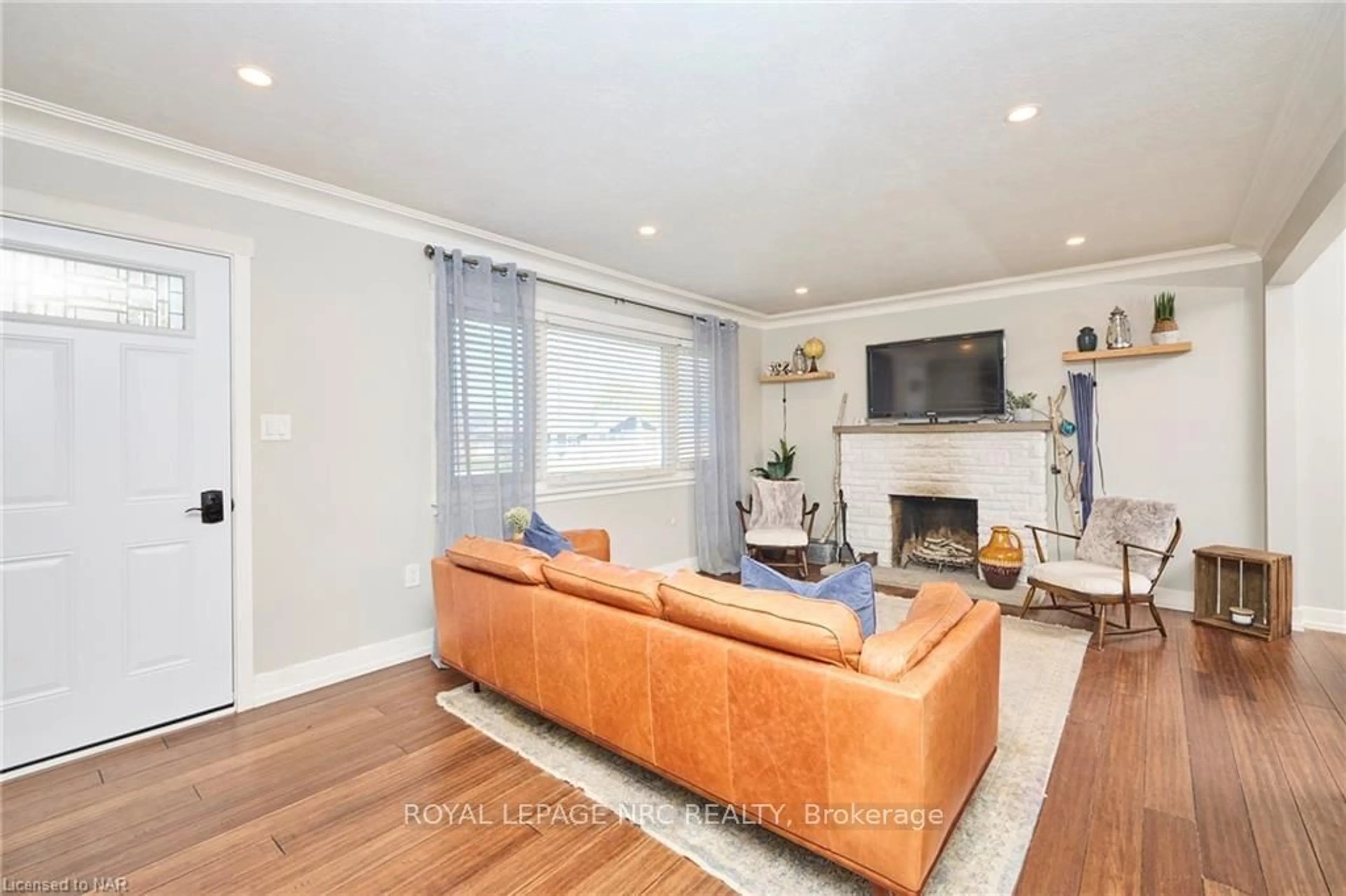 Living room, wood floors for 12 CORBETT Ave, St. Catharines Ontario L2N 5M5