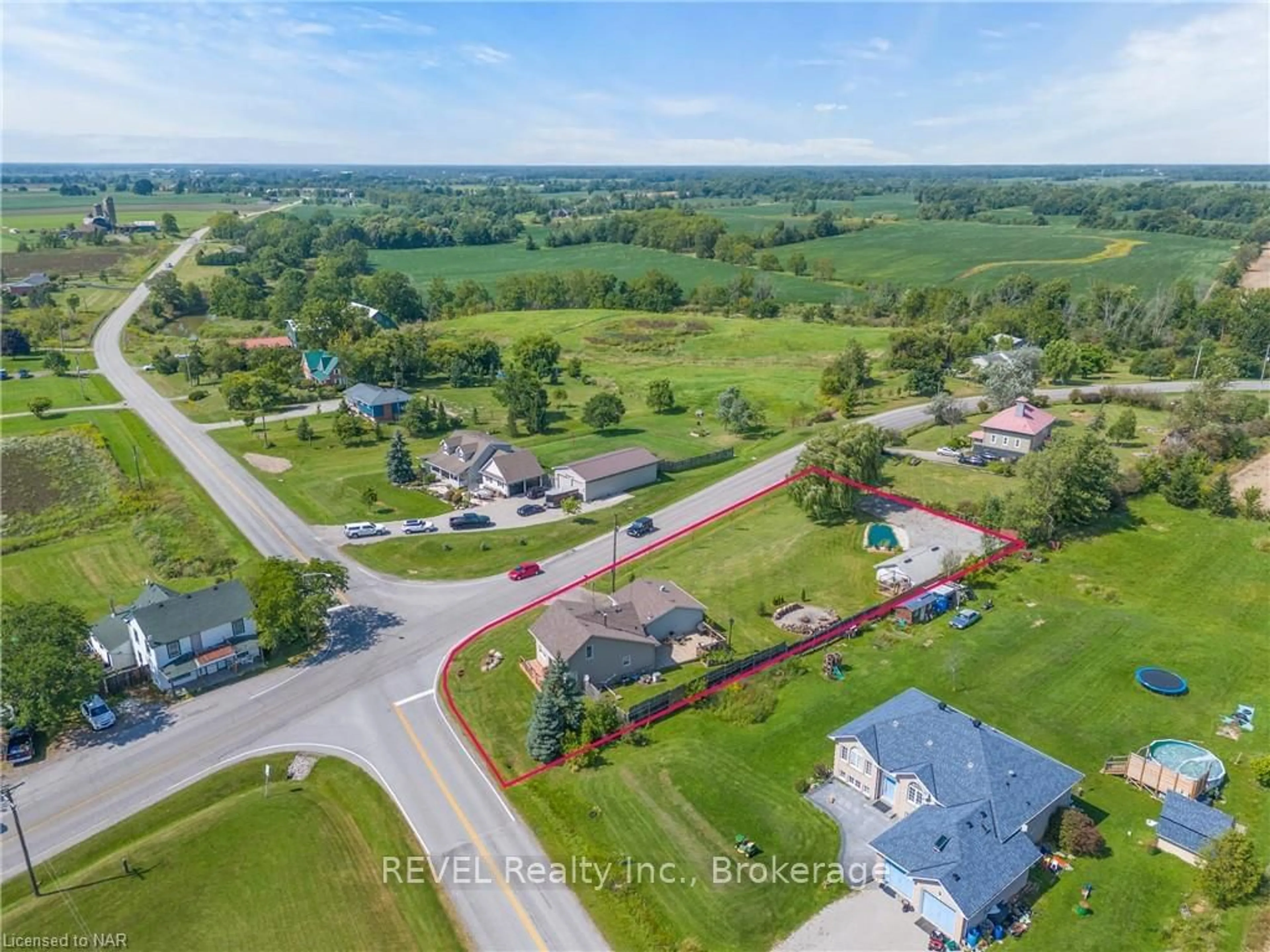 Frontside or backside of a home, the fenced backyard for 703 SMITHVILLE RD Rd, West Lincoln Ontario L0R 2J0