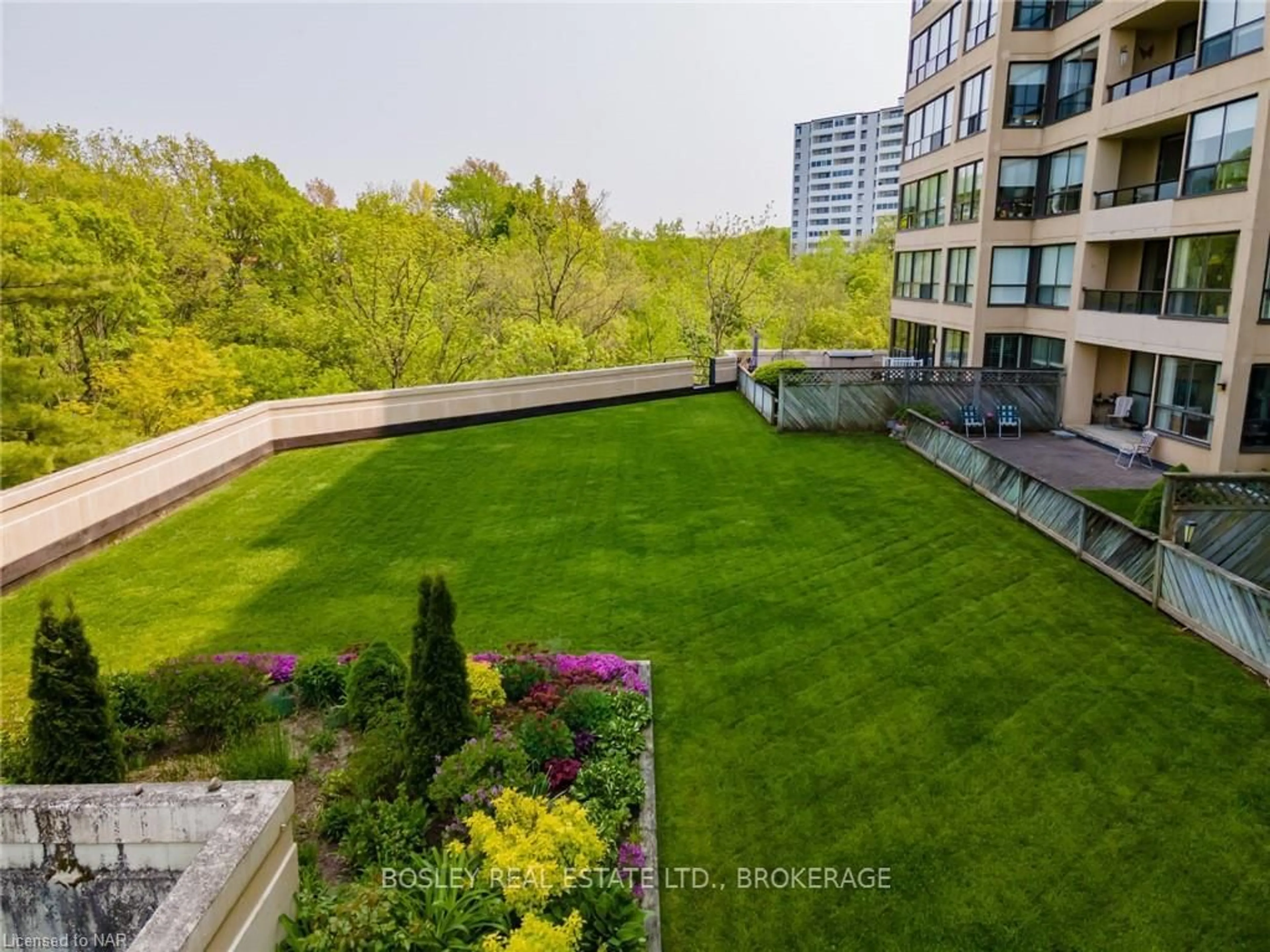 A pic from exterior of the house or condo, the fenced backyard for 3 TOWERING HEIGHTS Blvd #605, St. Catharines Ontario L2T 4A4