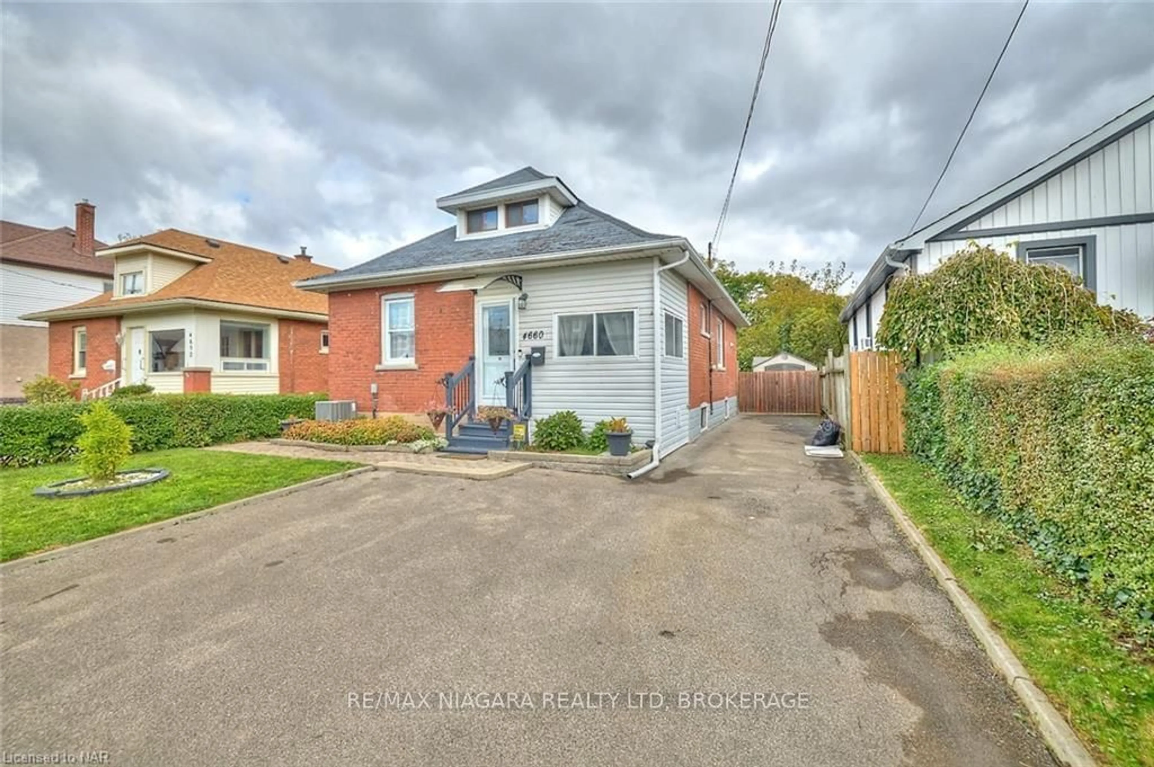 Frontside or backside of a home, the fenced backyard for 4660 SIXTH Ave, Niagara Falls Ontario L2E 4T5