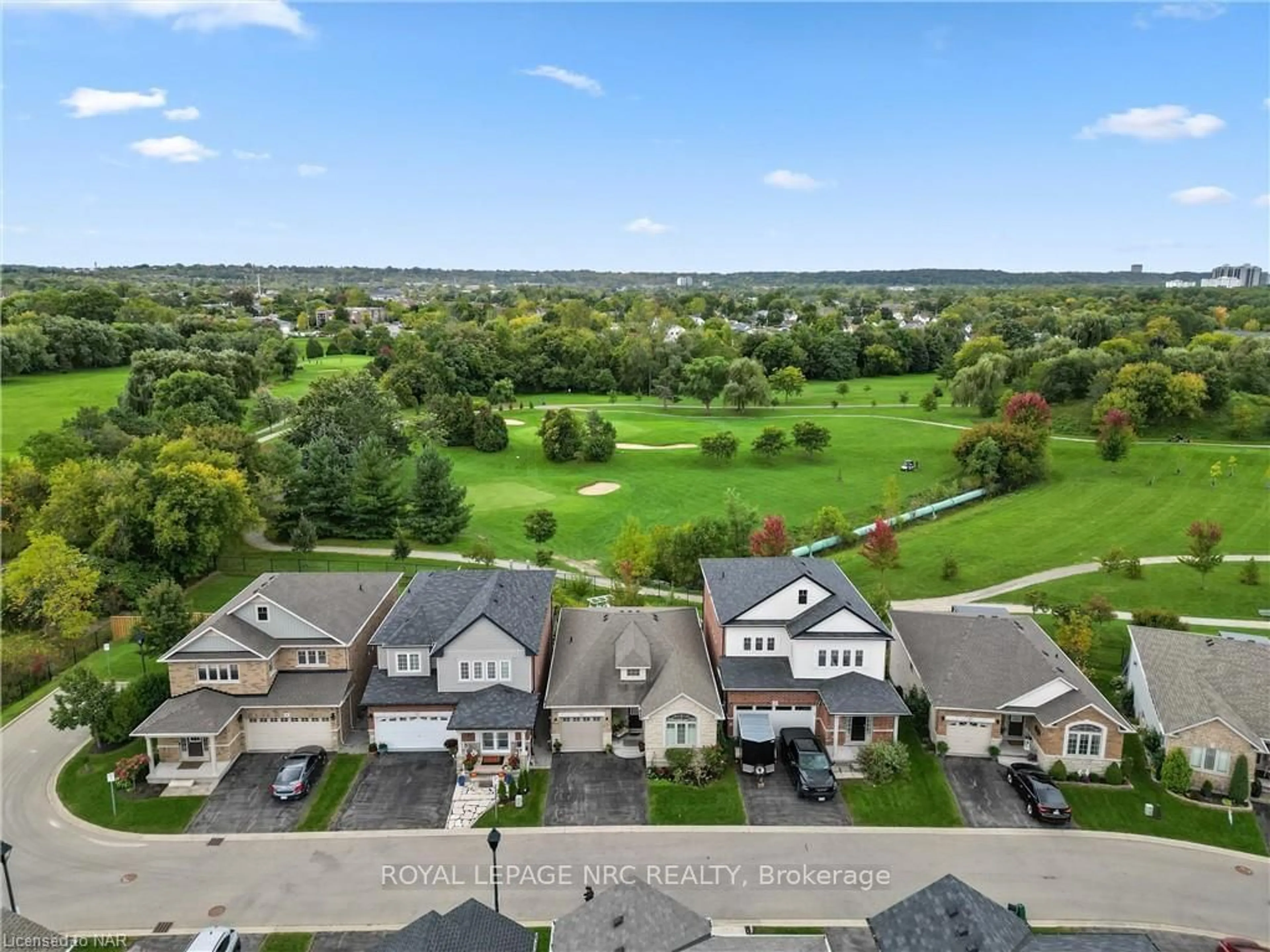 A pic from exterior of the house or condo, the fenced backyard for 77 AVERY Cres #11, St. Catharines Ontario L2P 0E5