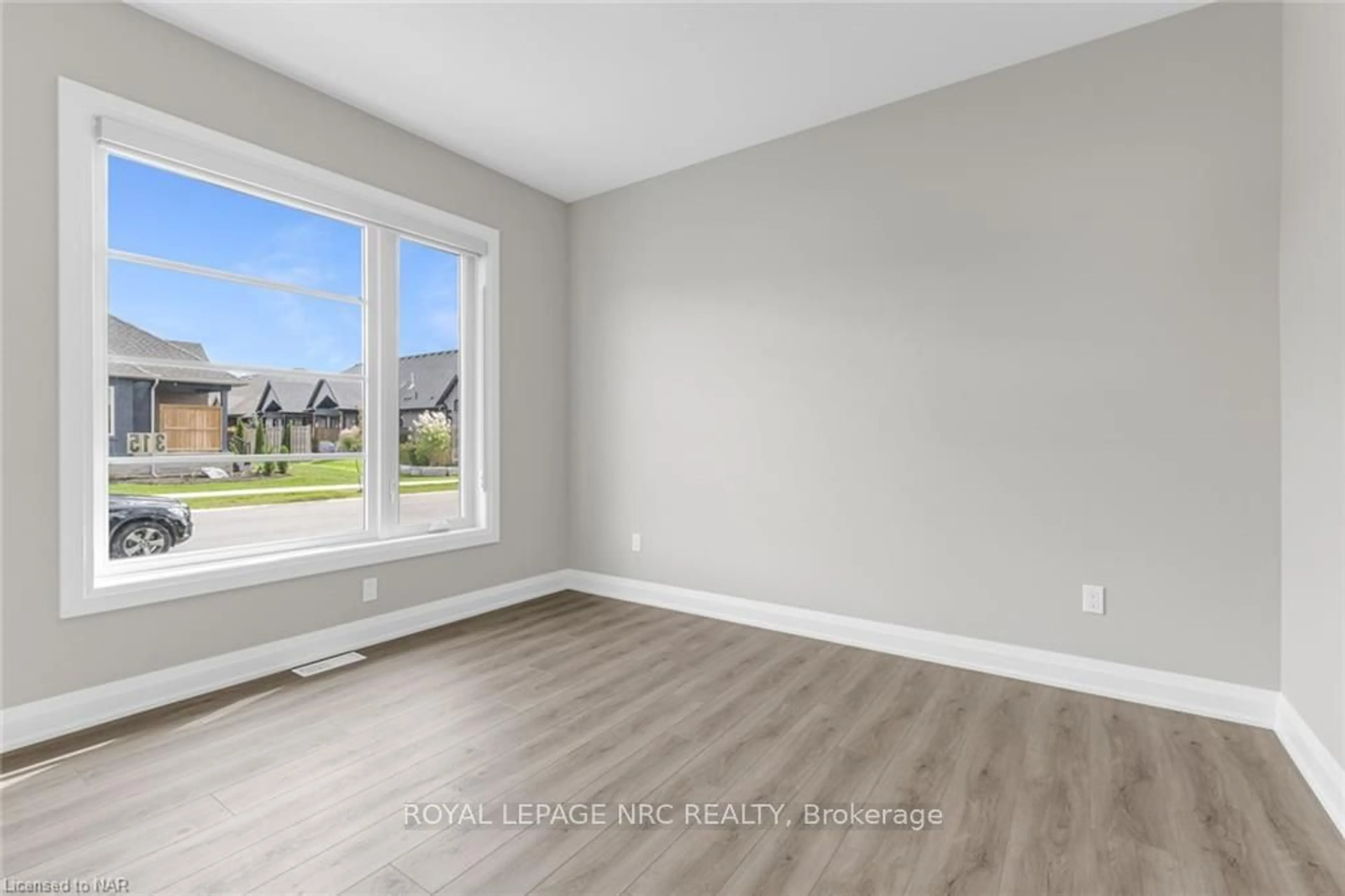 A pic of a room, wood floors for 315 OLD COURSE Tr, Welland Ontario L3B 0B6