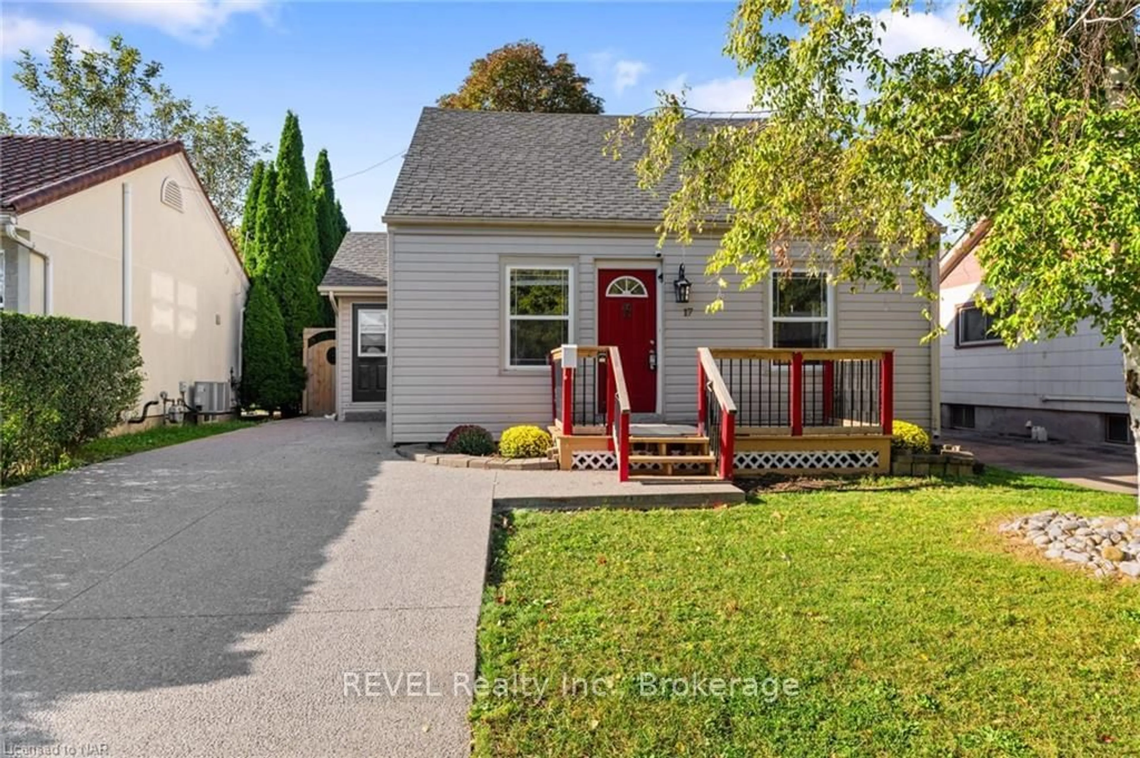 Frontside or backside of a home, the fenced backyard for 17 SANDOWN St, St. Catharines Ontario L2N 1X9