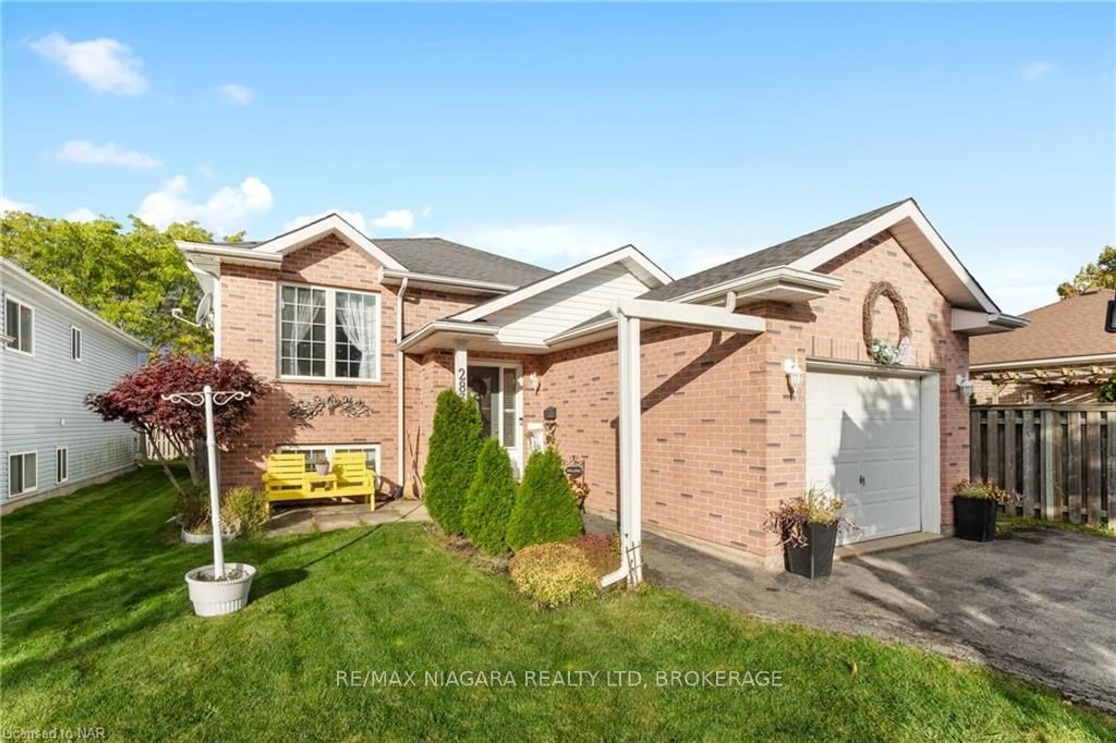 Frontside or backside of a home, the fenced backyard for 283 OAKCREST Ave, Welland Ontario L3C 7K3