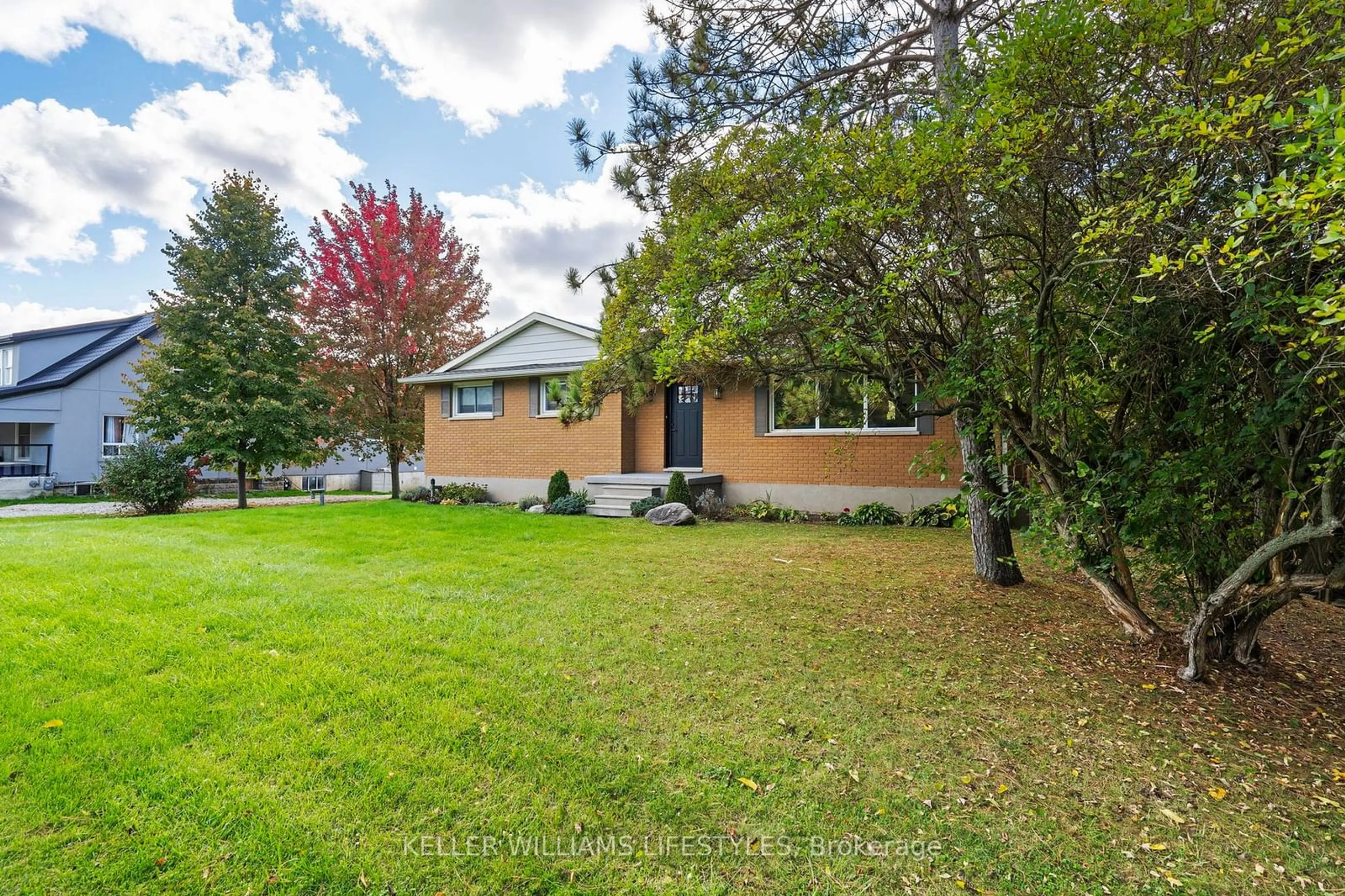 Frontside or backside of a home, the fenced backyard for 10759 Sunset Rd, Southwold Ontario N5P 3T2