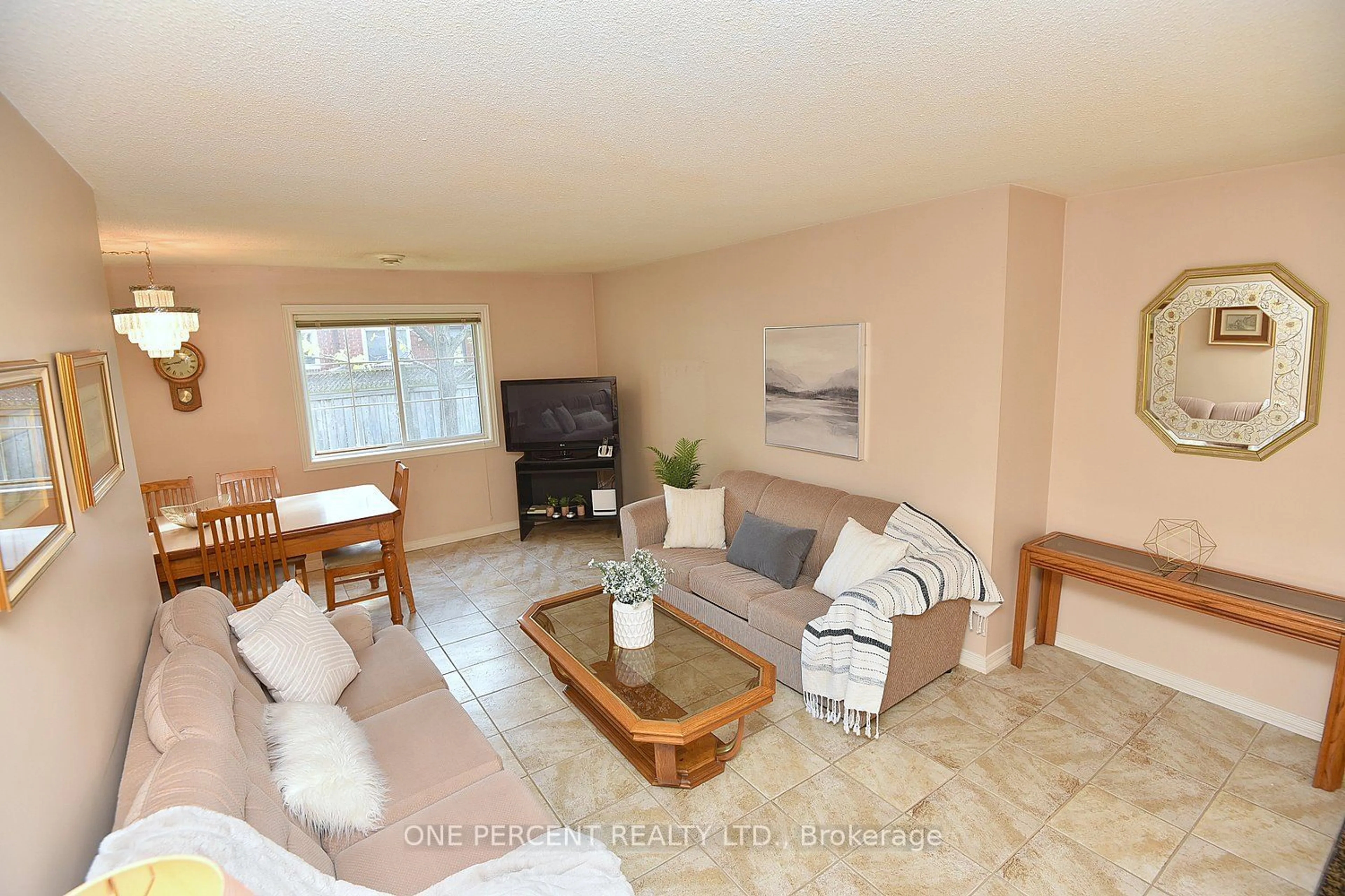 Living room, wood floors for 897 Stone Church Rd #4, Hamilton Ontario L8W 1B2