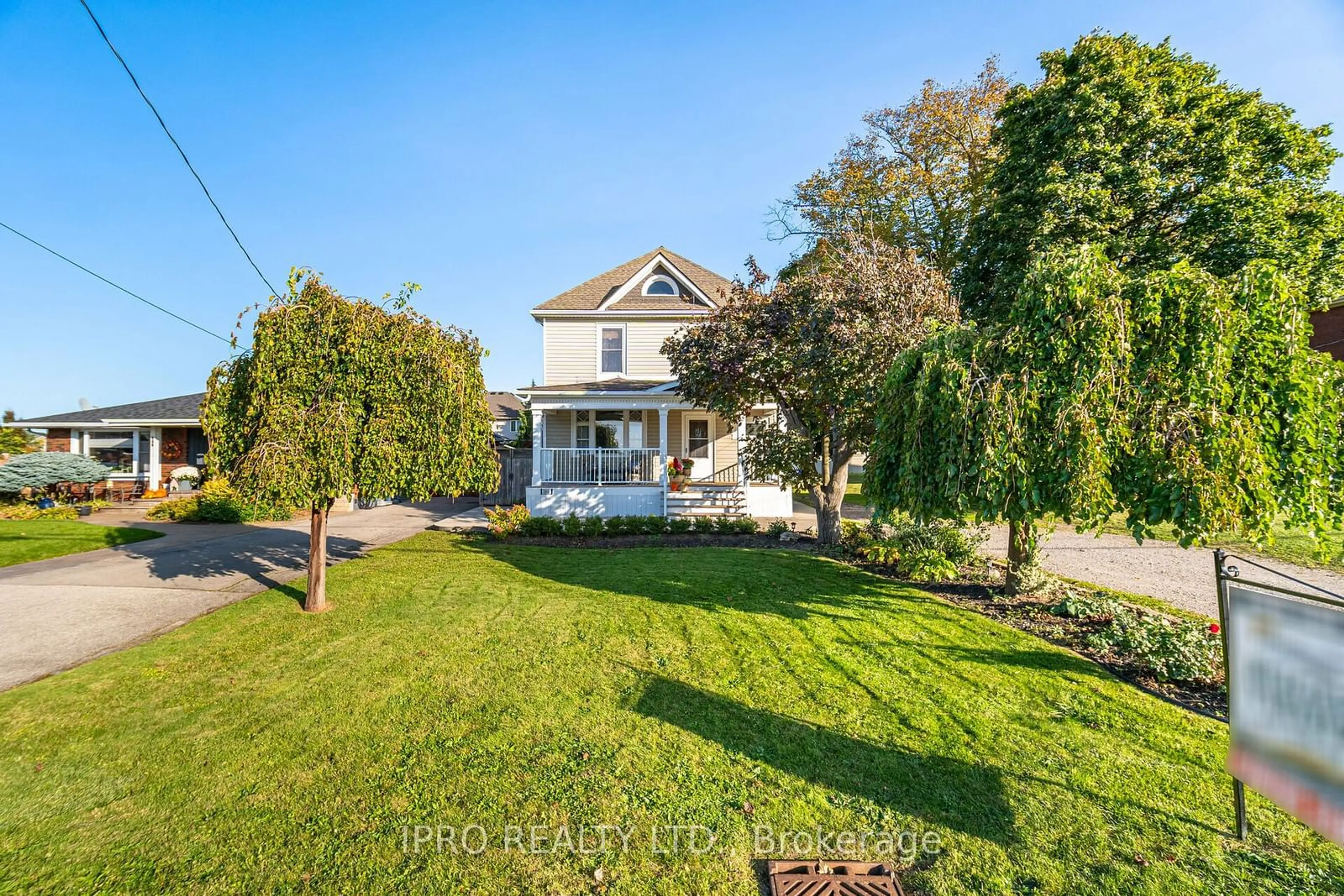 Frontside or backside of a home, the fenced backyard for 264 Winona Rd, Hamilton Ontario L8E 5L3