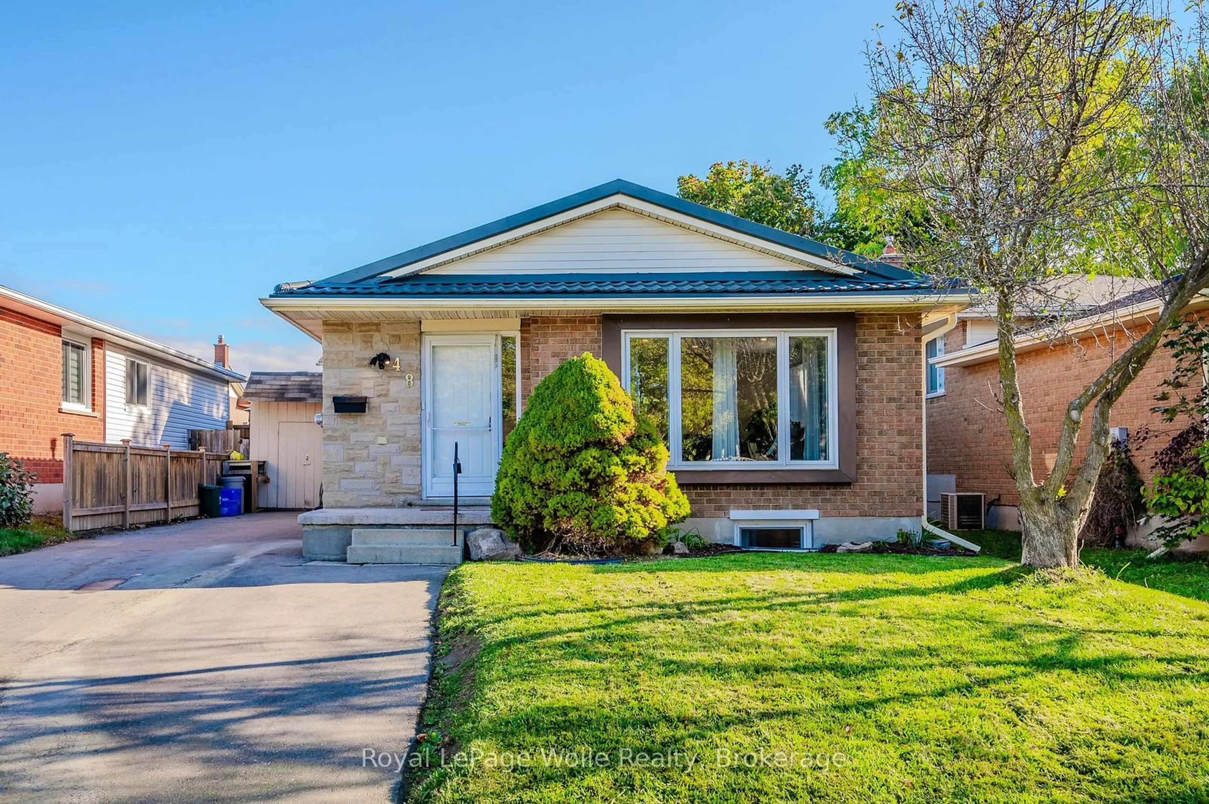 Home with brick exterior material for 48 Summerhill Cres, Kitchener Ontario N2N 2T5