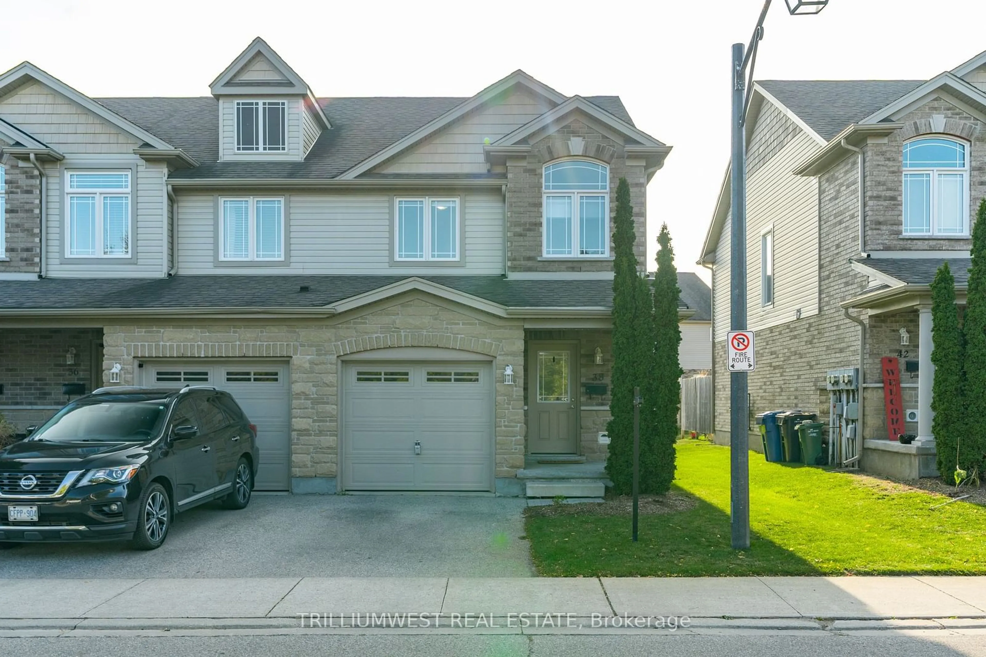 A pic from exterior of the house or condo, the street view for 38 Waterford Dr, Guelph Ontario N1L 0H6