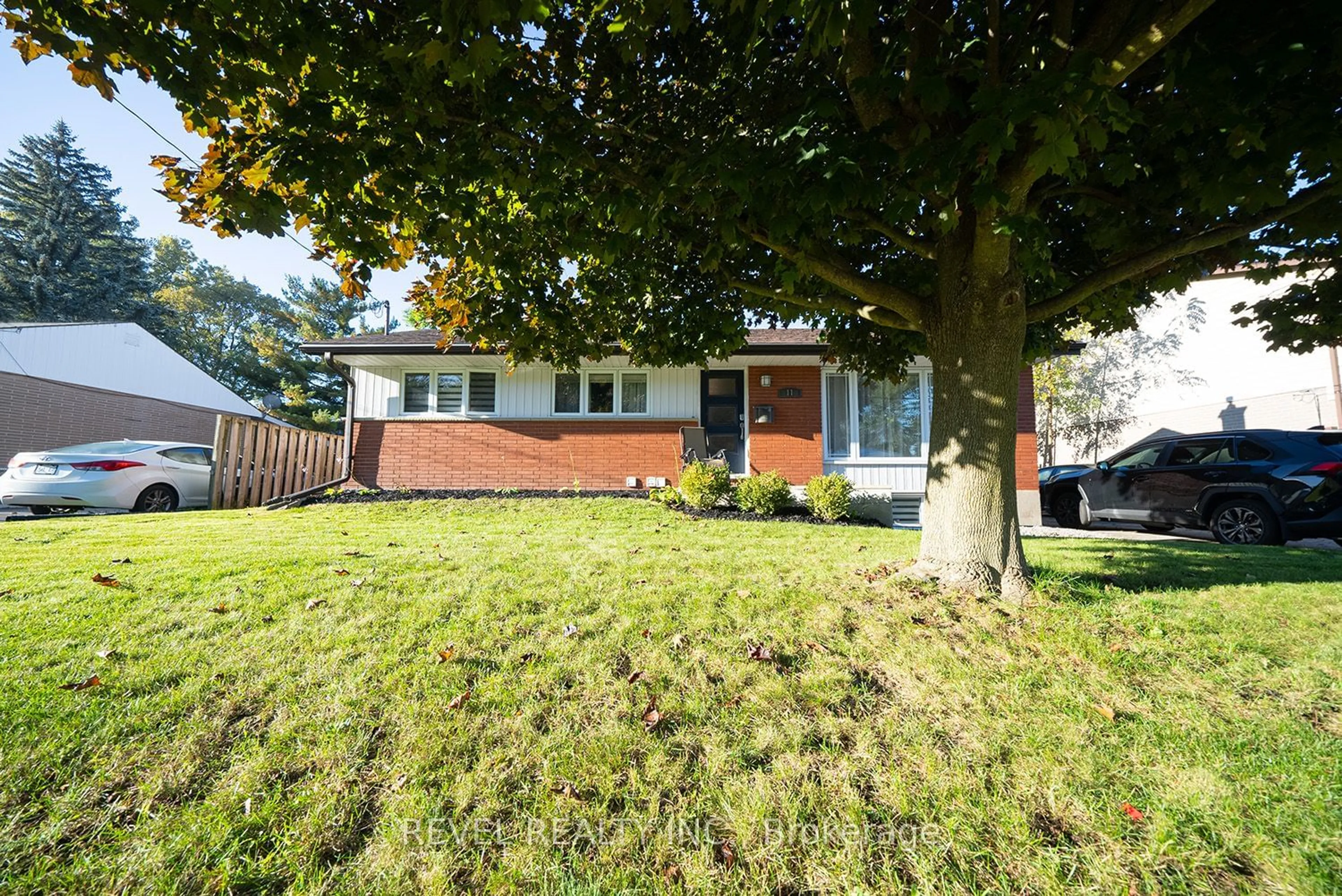 Frontside or backside of a home, the fenced backyard for 11 Hillcrest Ave, Brantford Ontario N3T 2C8