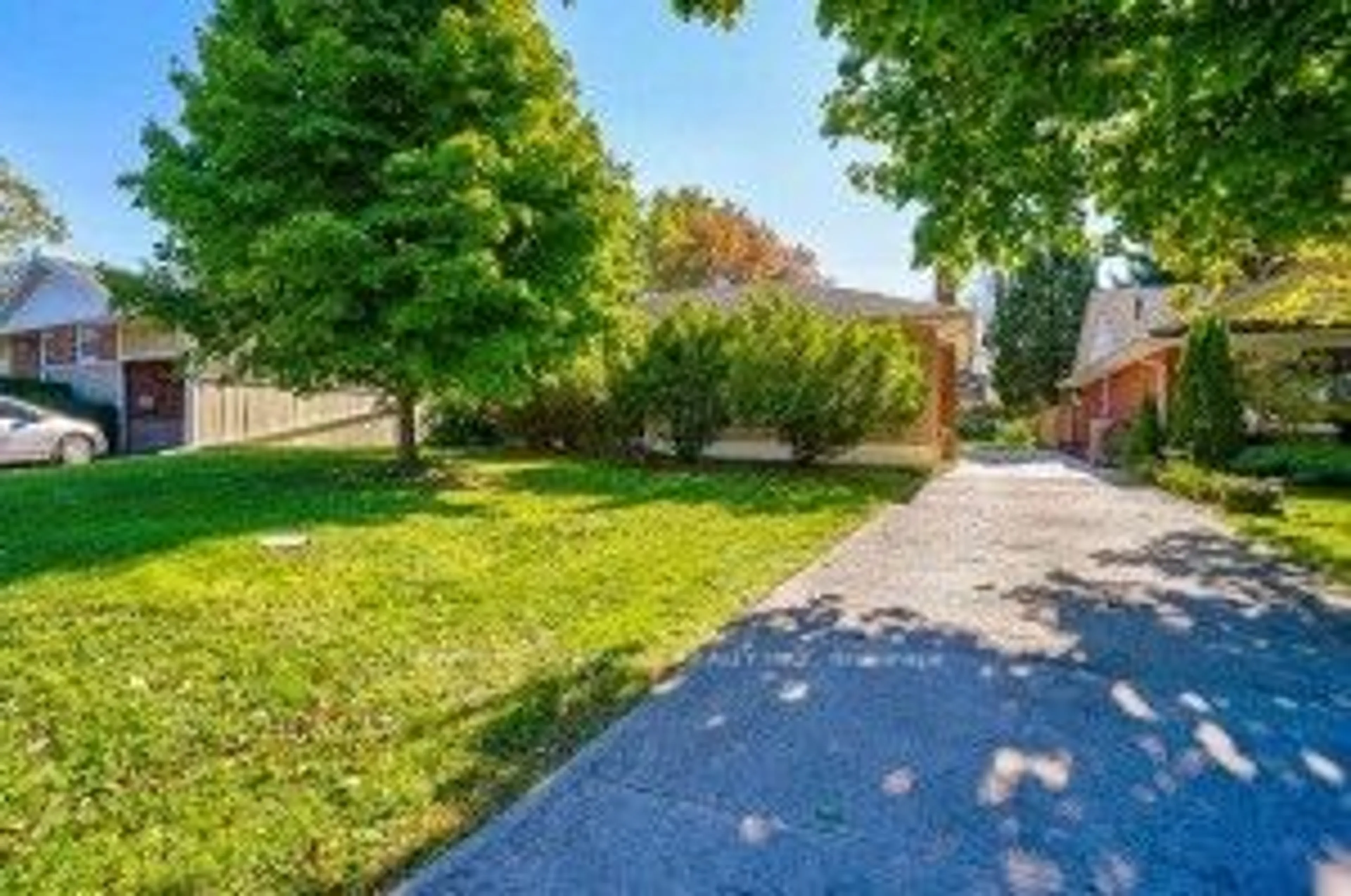 Frontside or backside of a home, the fenced backyard for 12 Macbeth Blvd, St. Catharines Ontario L2T 2M2