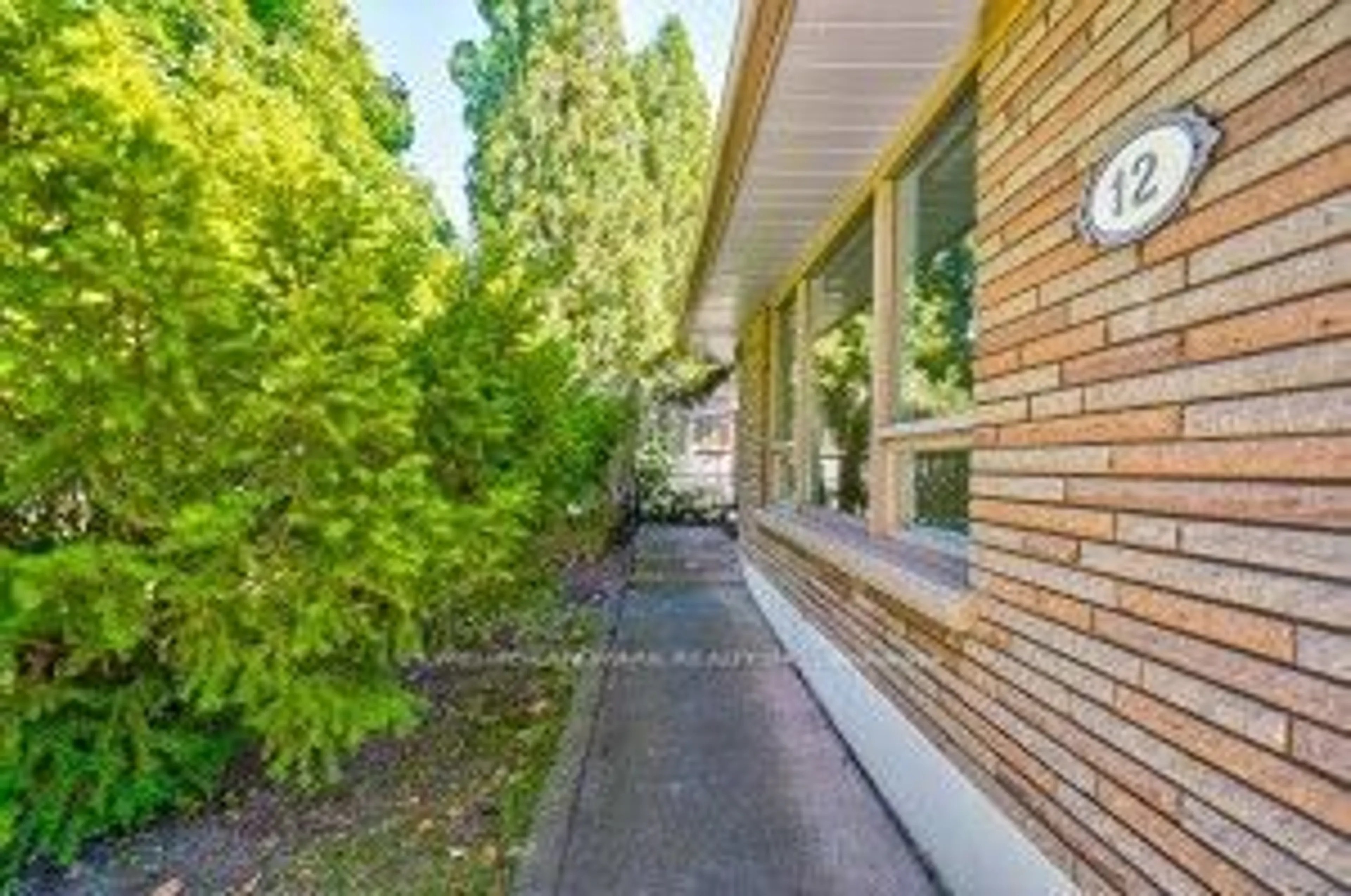 A pic from exterior of the house or condo, the street view for 12 Macbeth Blvd, St. Catharines Ontario L2T 2M2