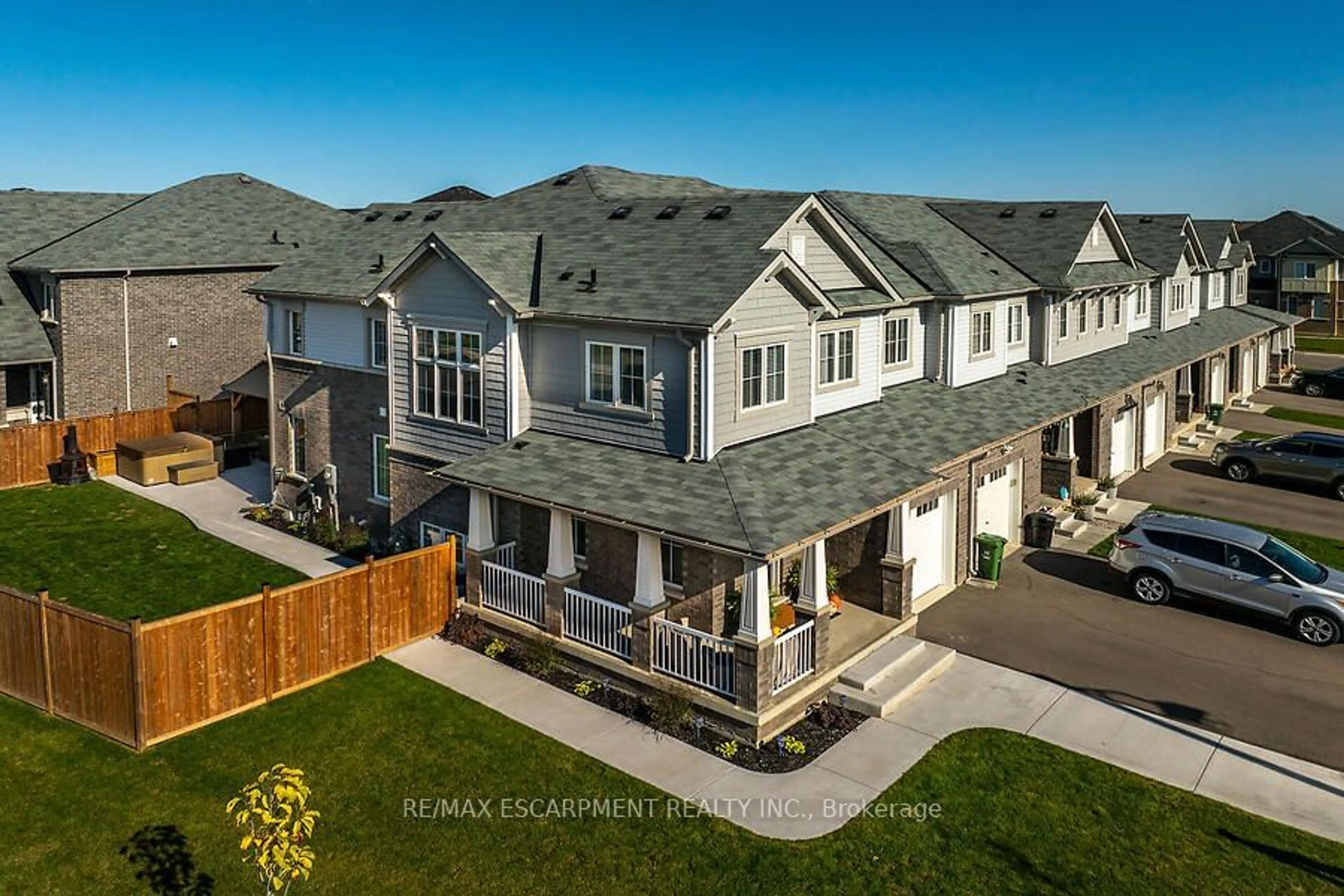 Frontside or backside of a home, the fenced backyard for 328 Pumpkin Pass, Hamilton Ontario L0R 1C0