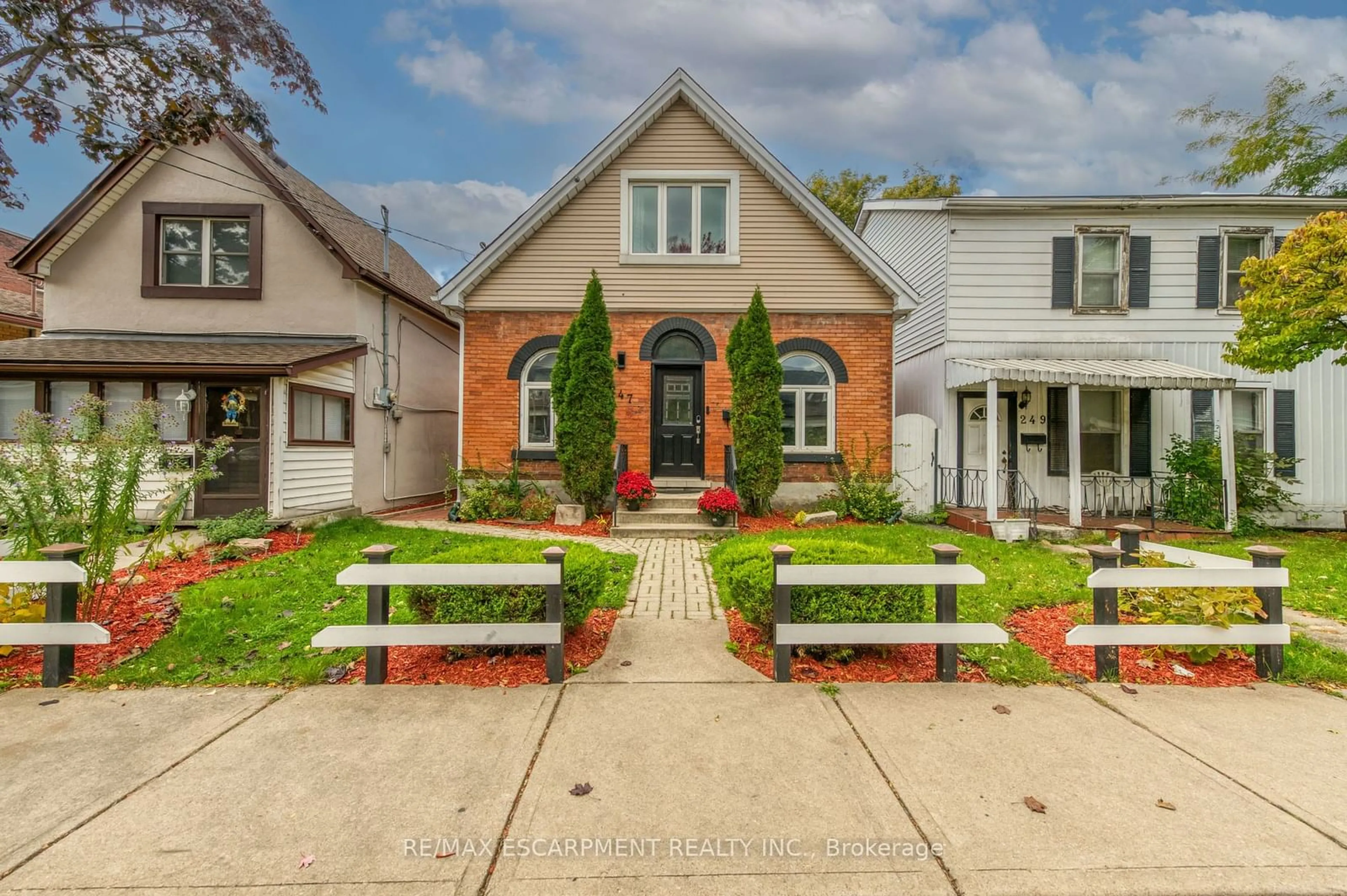 Frontside or backside of a home, the street view for 247 Kensington Ave, Hamilton Ontario L8L 7N8