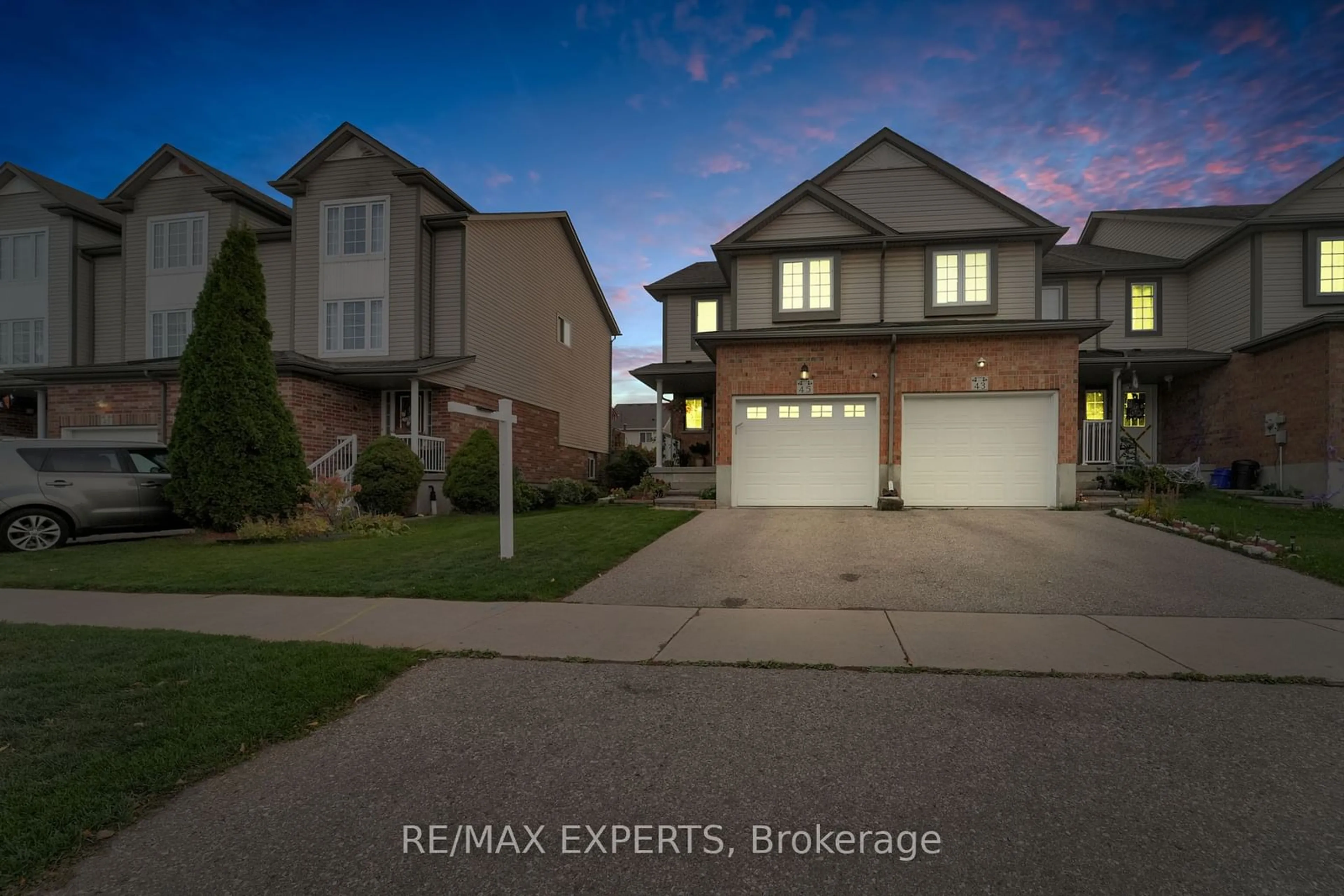 Frontside or backside of a home, the street view for 45 Max Becker Dr, Kitchener Ontario N2E 3V8