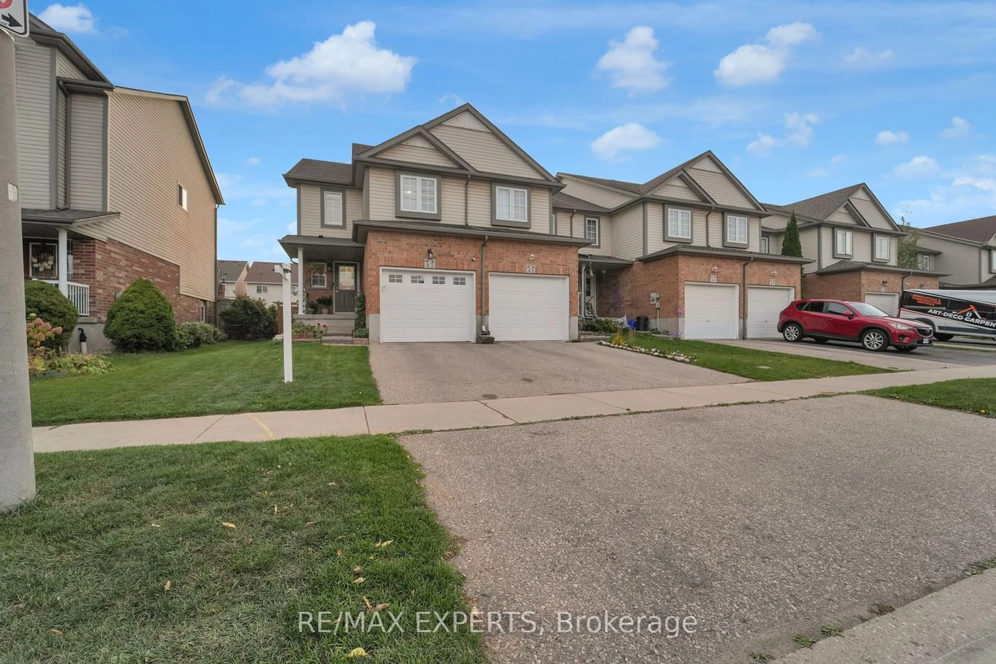 Frontside or backside of a home, the street view for 45 Max Becker Dr, Kitchener Ontario N2E 3V8