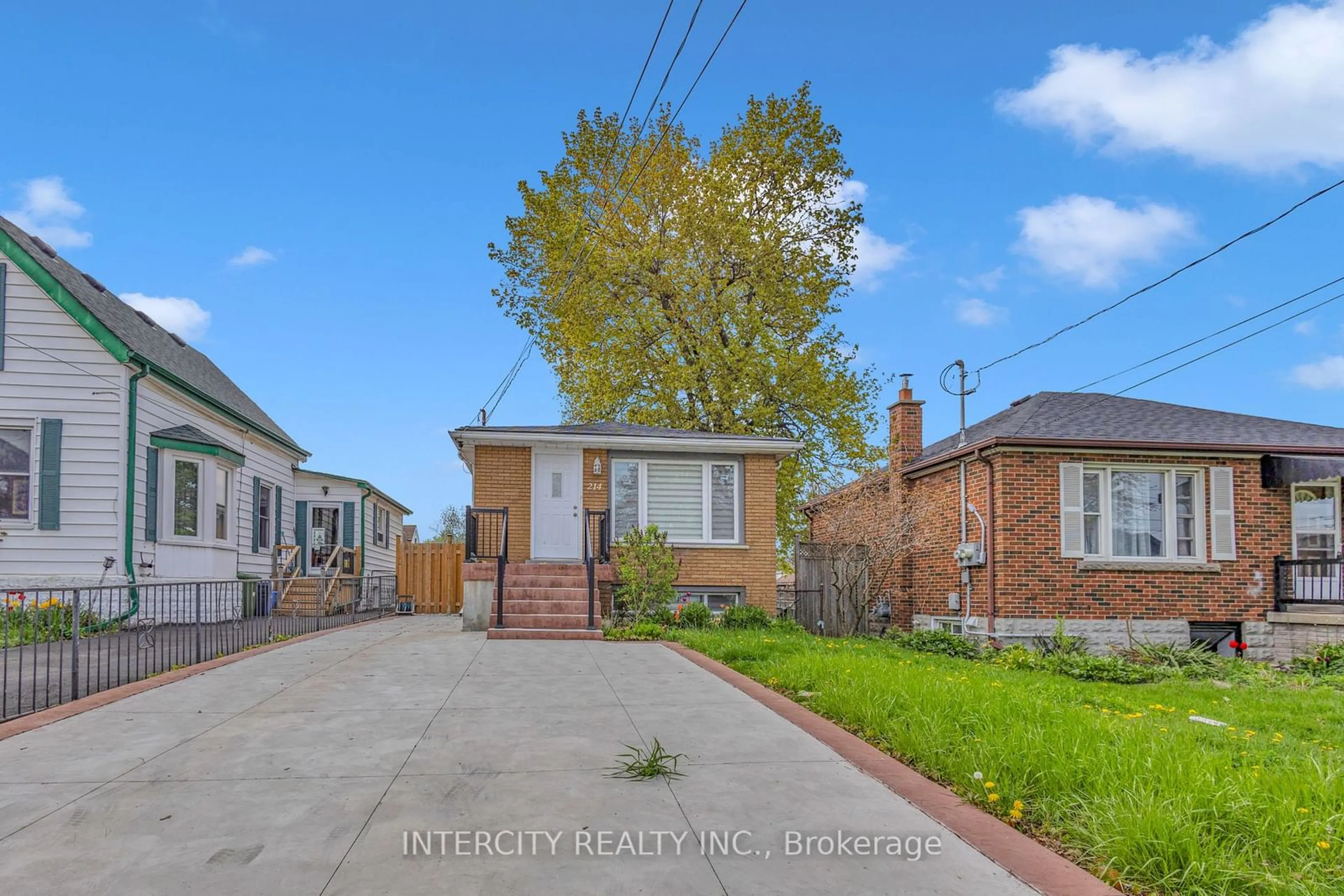 Frontside or backside of a home, the fenced backyard for 214 East 15th St, Hamilton Ontario L9A 4G2