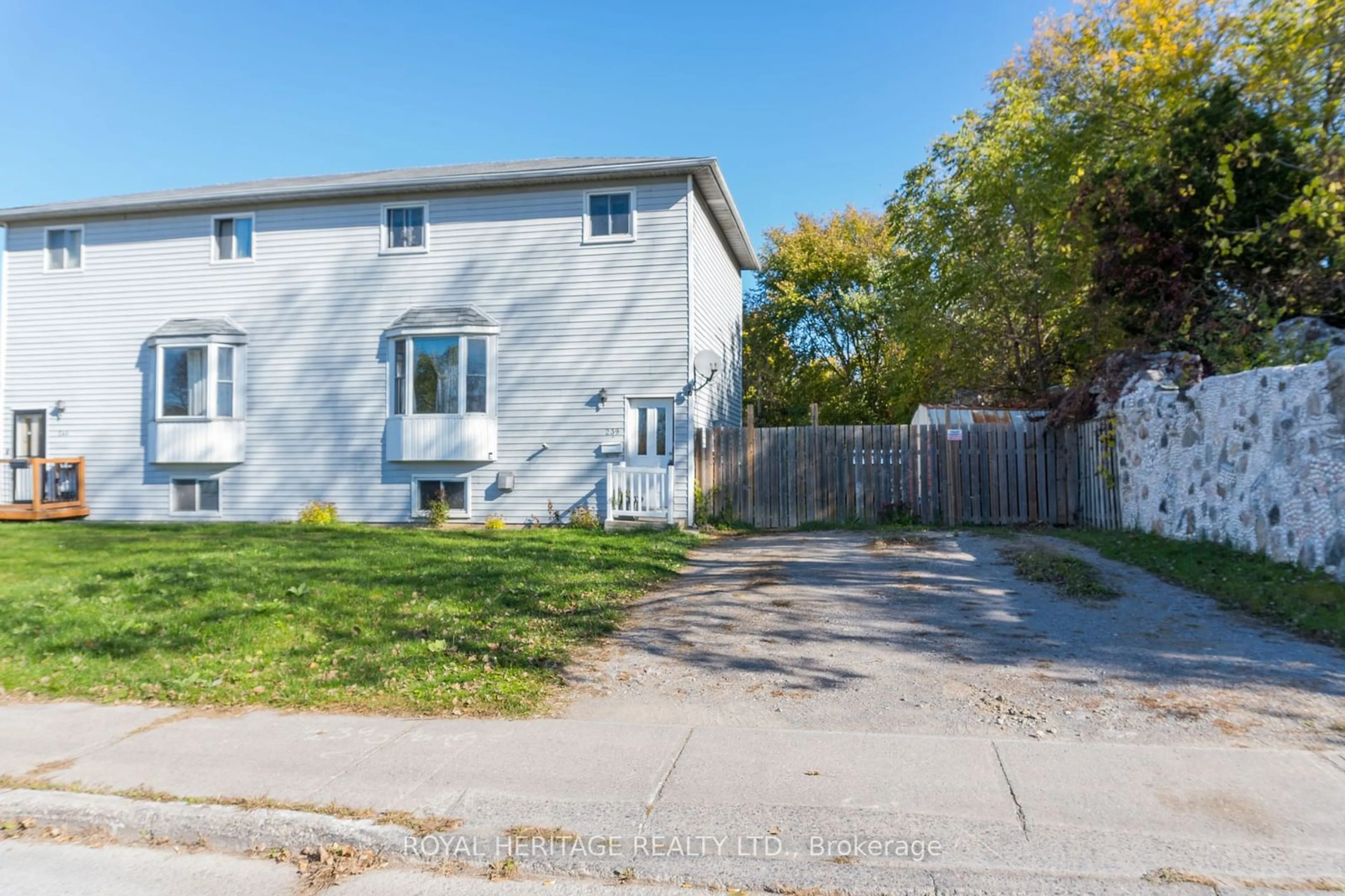 A pic from exterior of the house or condo, the fenced backyard for 239 Marmora St, Quinte West Ontario K8V 2J8