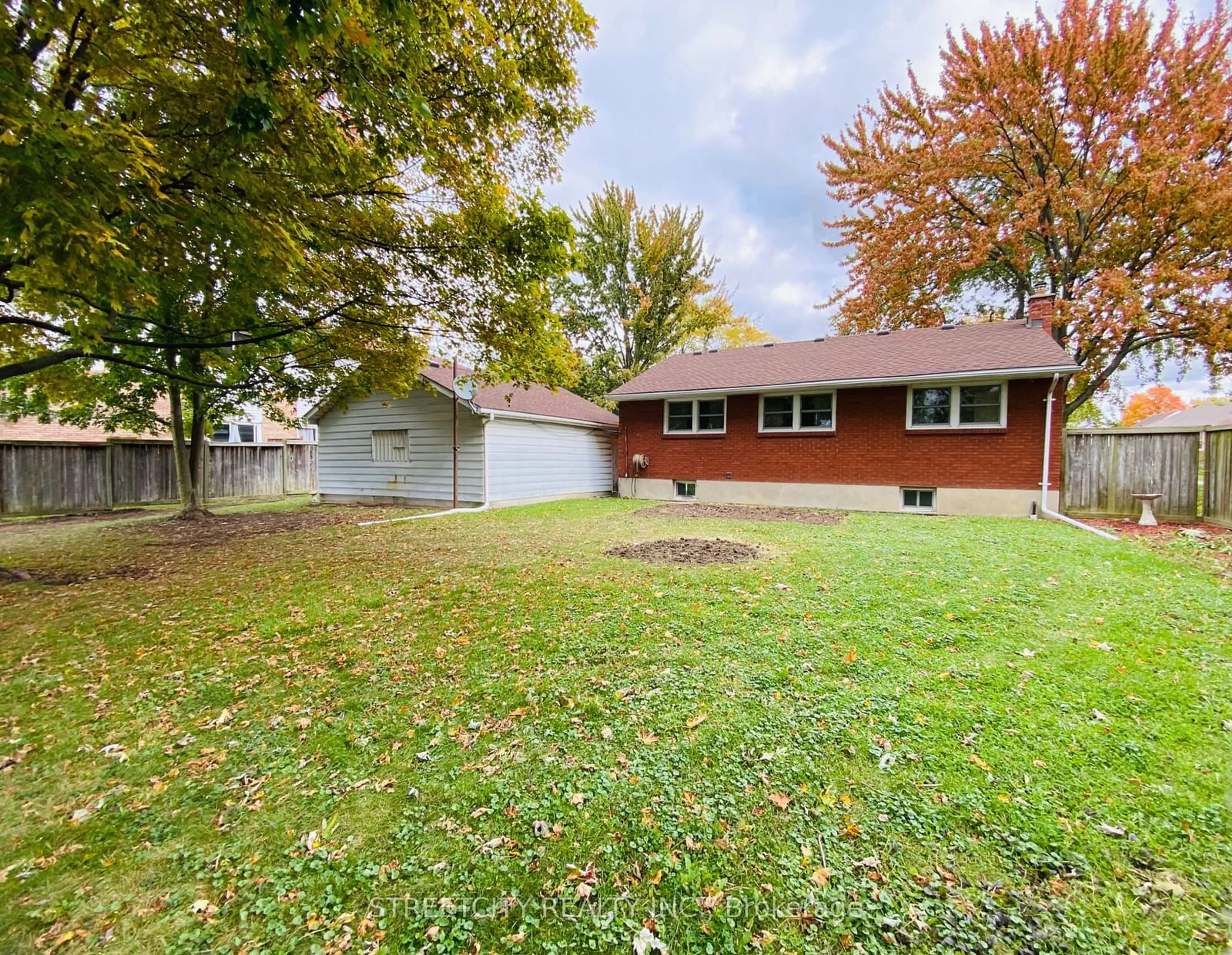 Frontside or backside of a home, the fenced backyard for 359 Murray St, St. Clair Ontario N0N 1G0