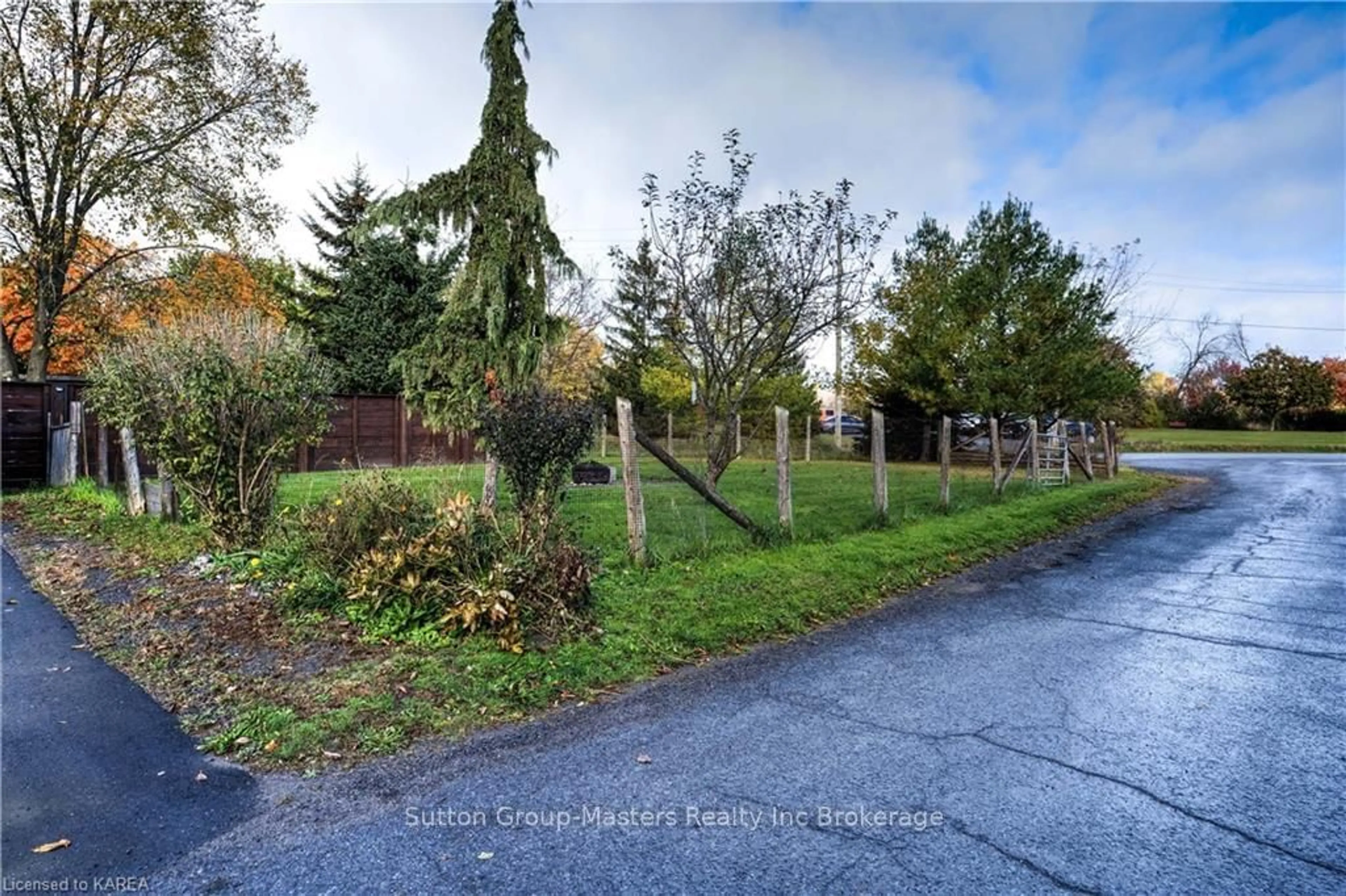 A pic from exterior of the house or condo, the fenced backyard for 98 MAIN STREET, Loyalist Ontario K0H 2H0