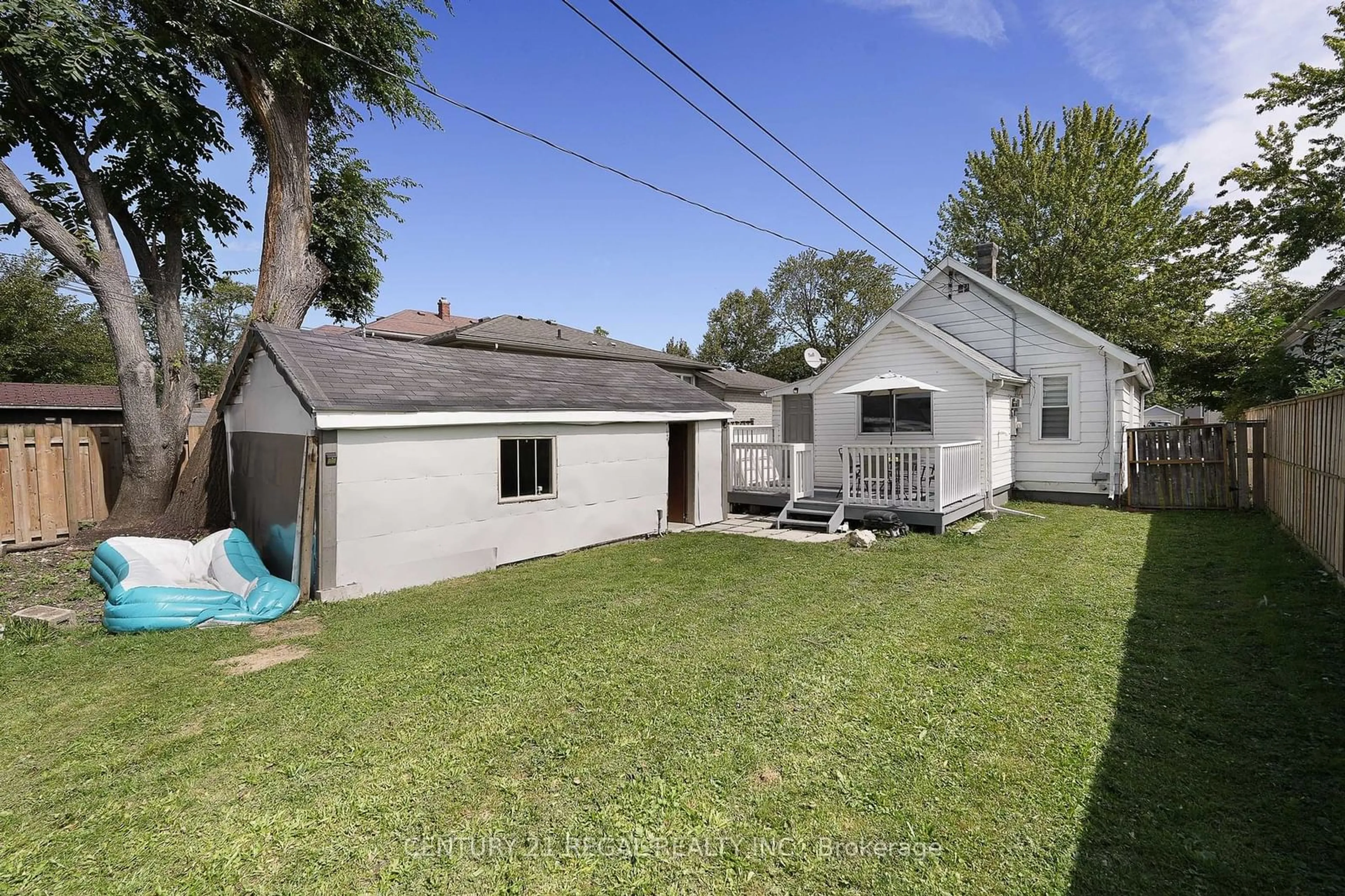 Frontside or backside of a home, the fenced backyard for 2325 Chandler Rd, Windsor Ontario N8W 4A5