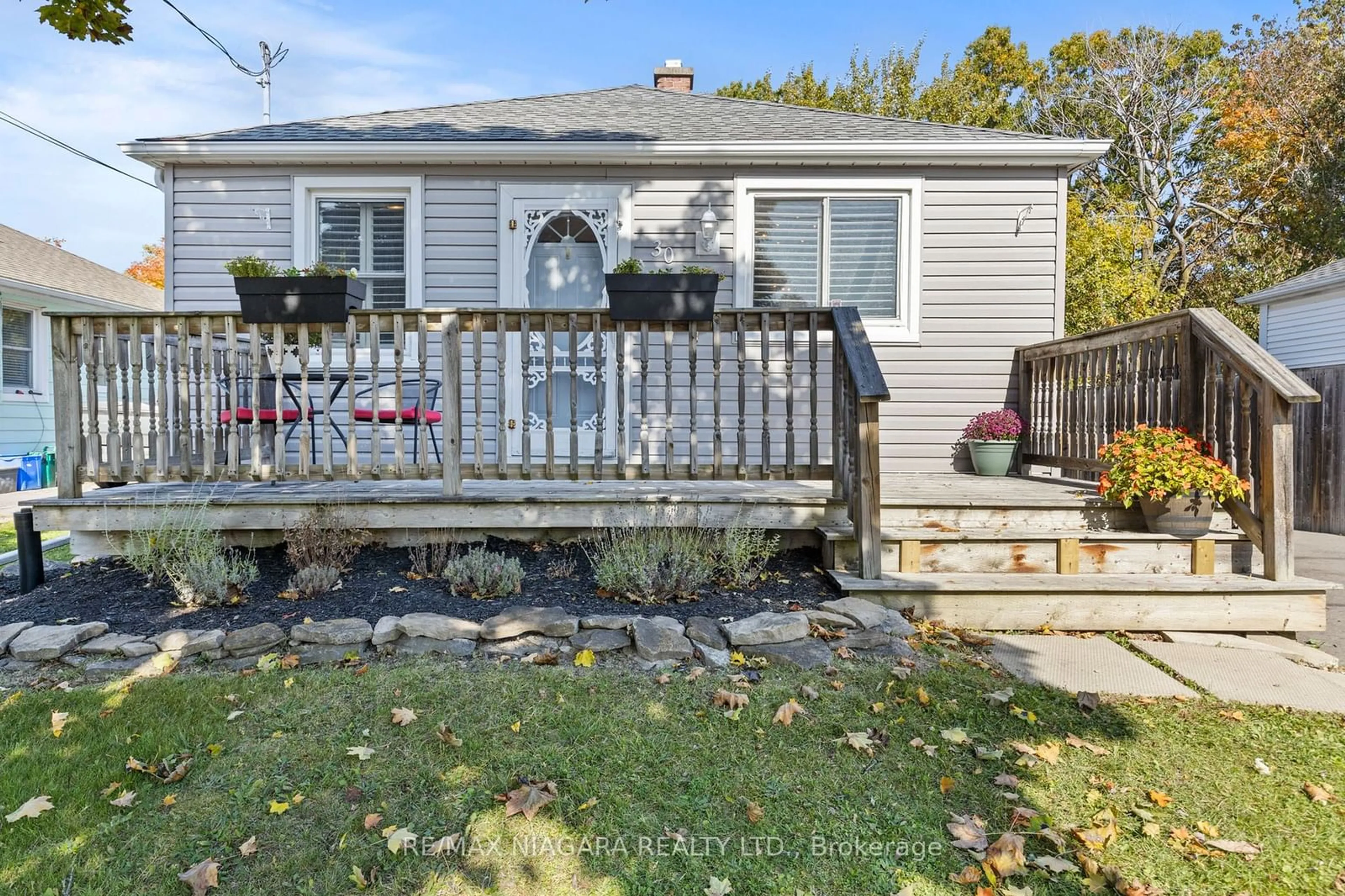 Frontside or backside of a home, the fenced backyard for 30 Argyle Cres, St. Catharines Ontario L2P 2P4