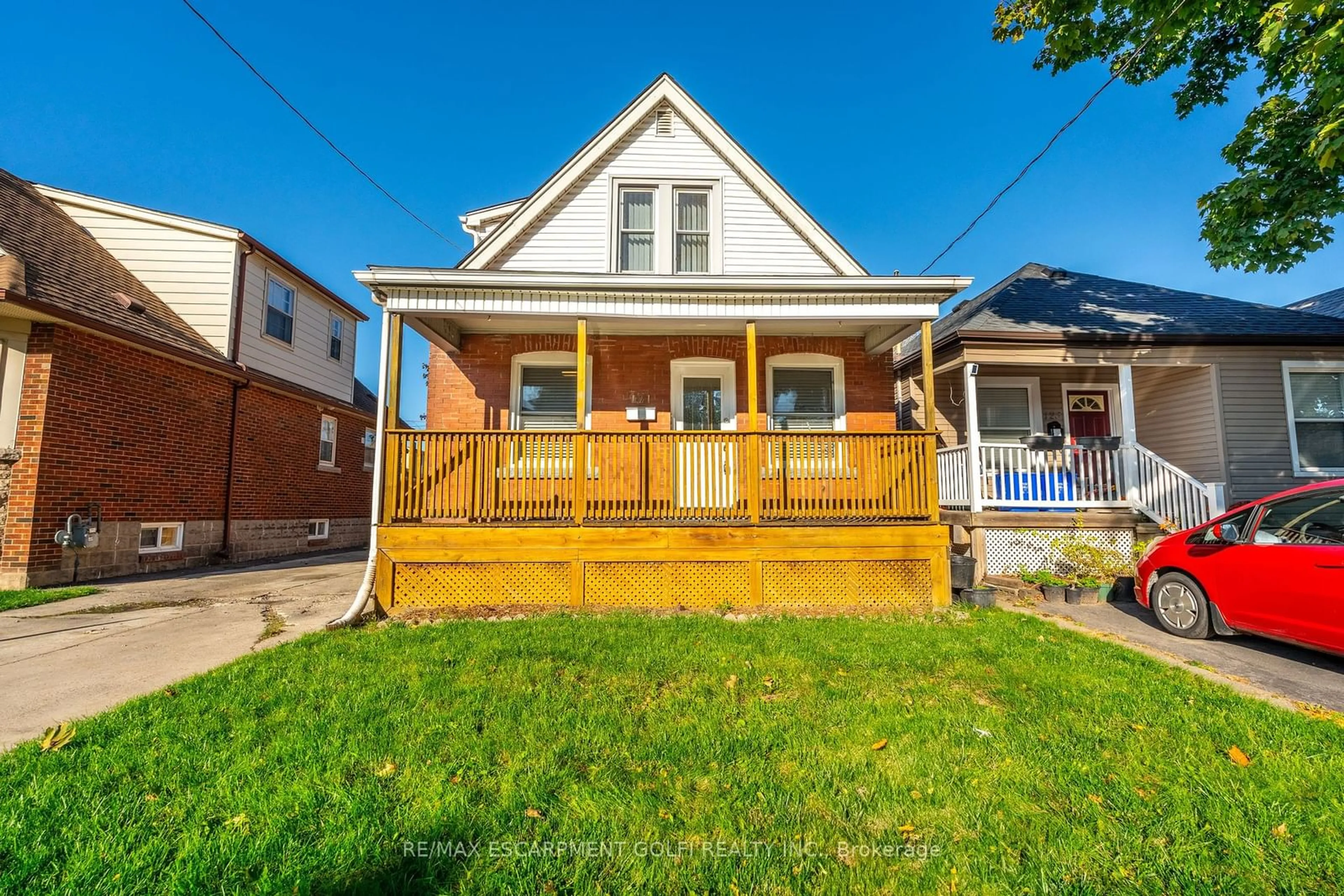 Frontside or backside of a home, the fenced backyard for 121 Barons Ave, Hamilton Ontario L8H 5A6