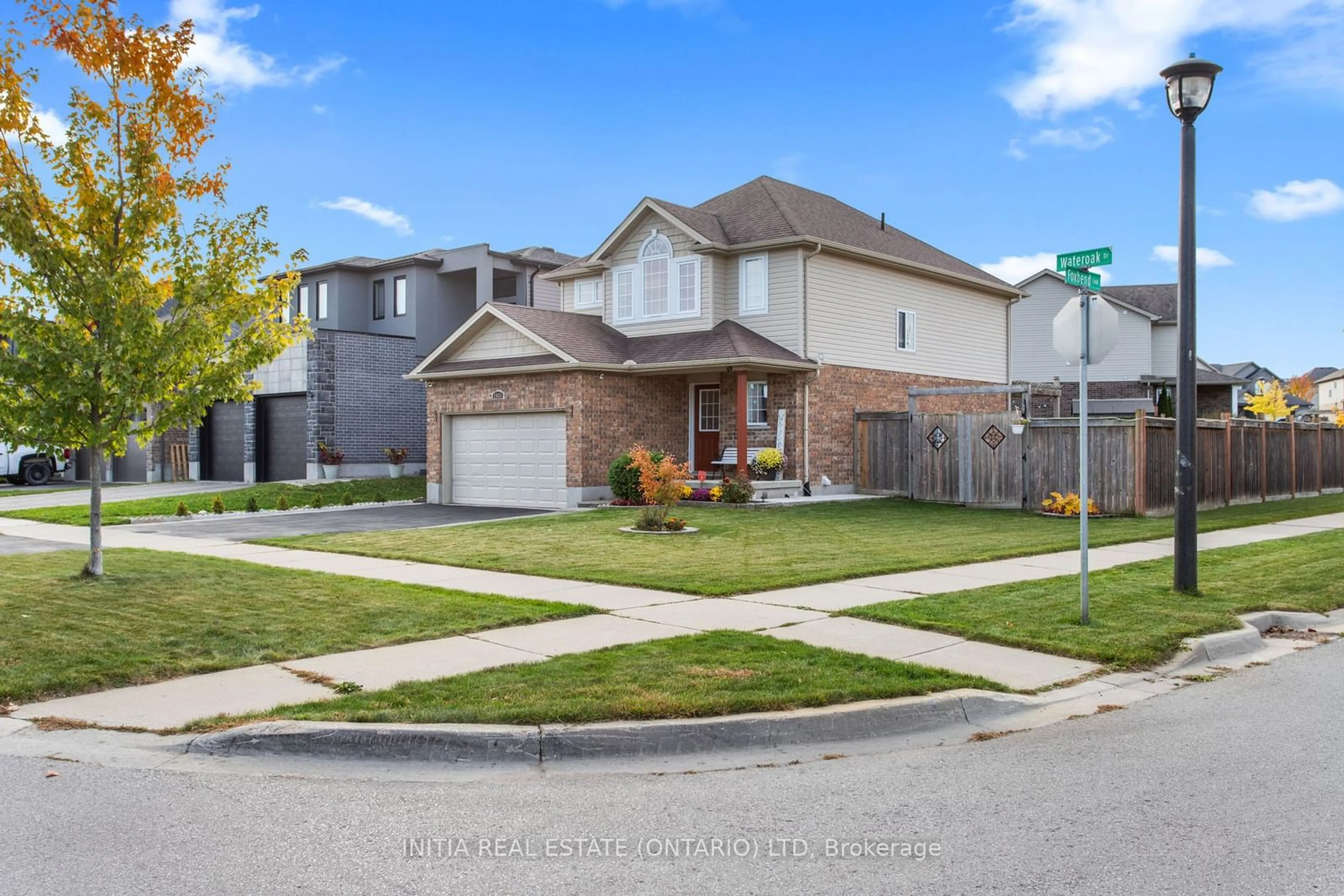 Frontside or backside of a home, the fenced backyard for 1931 Wateroak Dr, London Ontario N6G 0M7