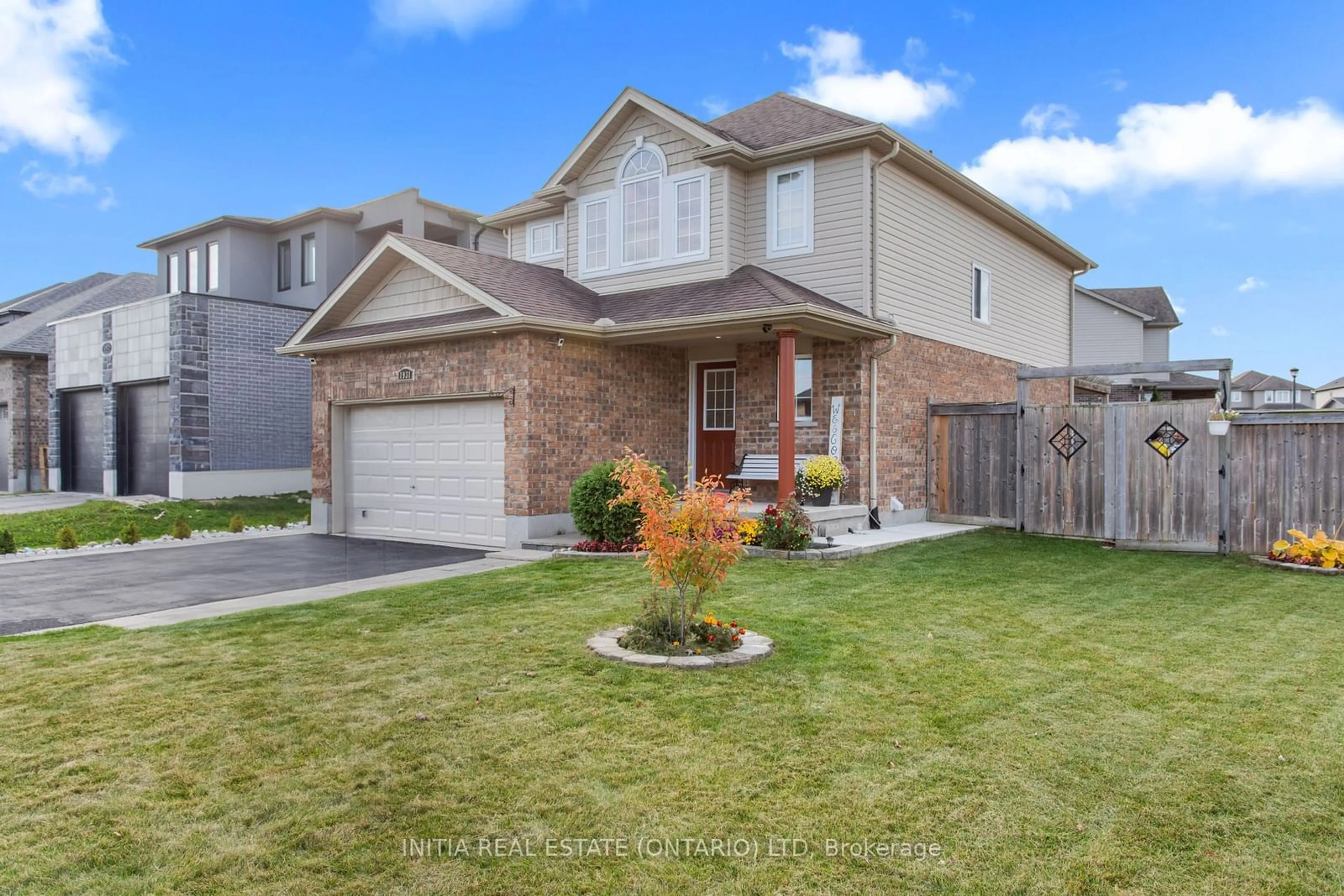 Frontside or backside of a home, the fenced backyard for 1931 Wateroak Dr, London Ontario N6G 0M7