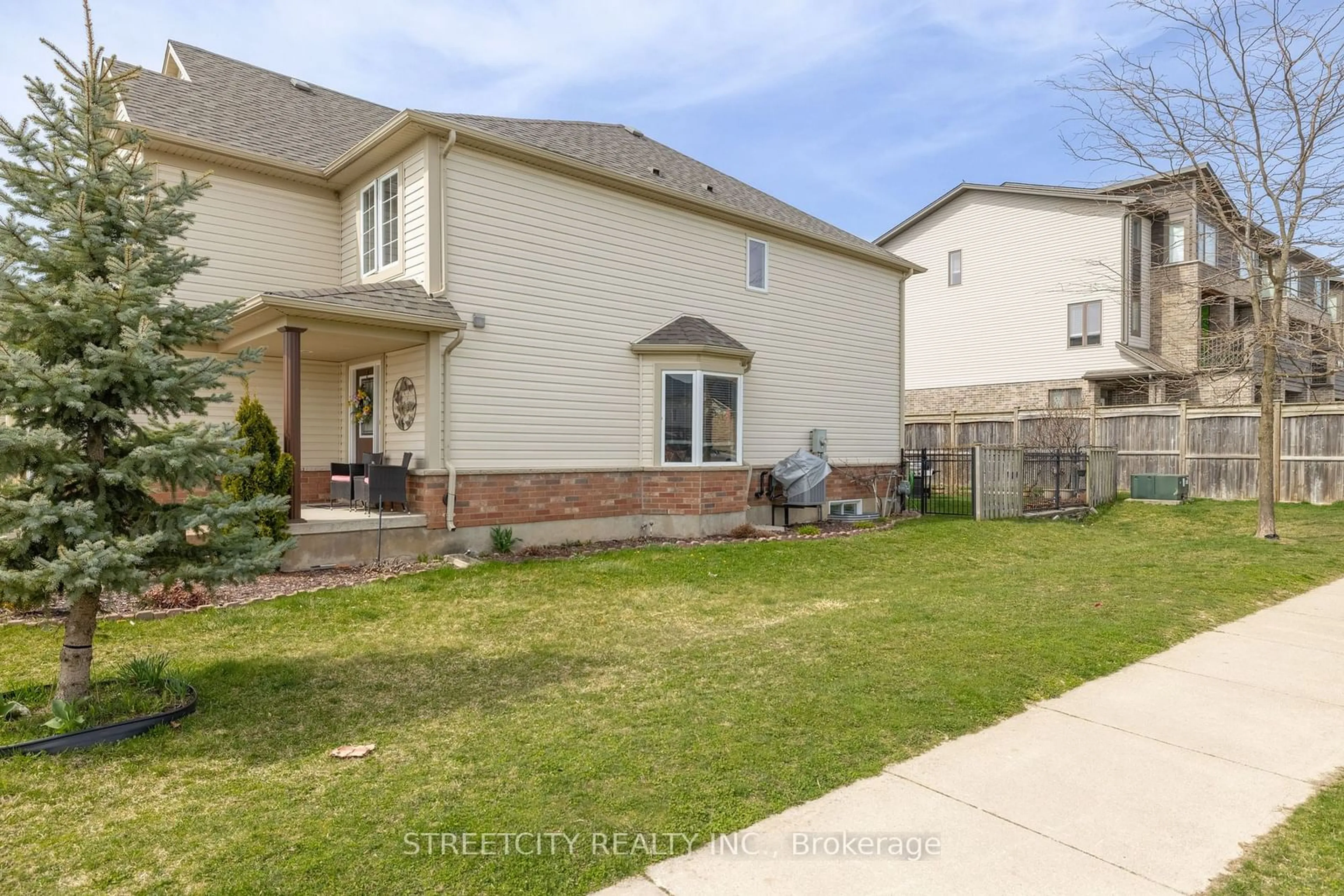 Frontside or backside of a home, the fenced backyard for 1434 Evans Blvd, London Ontario N6M 1L6