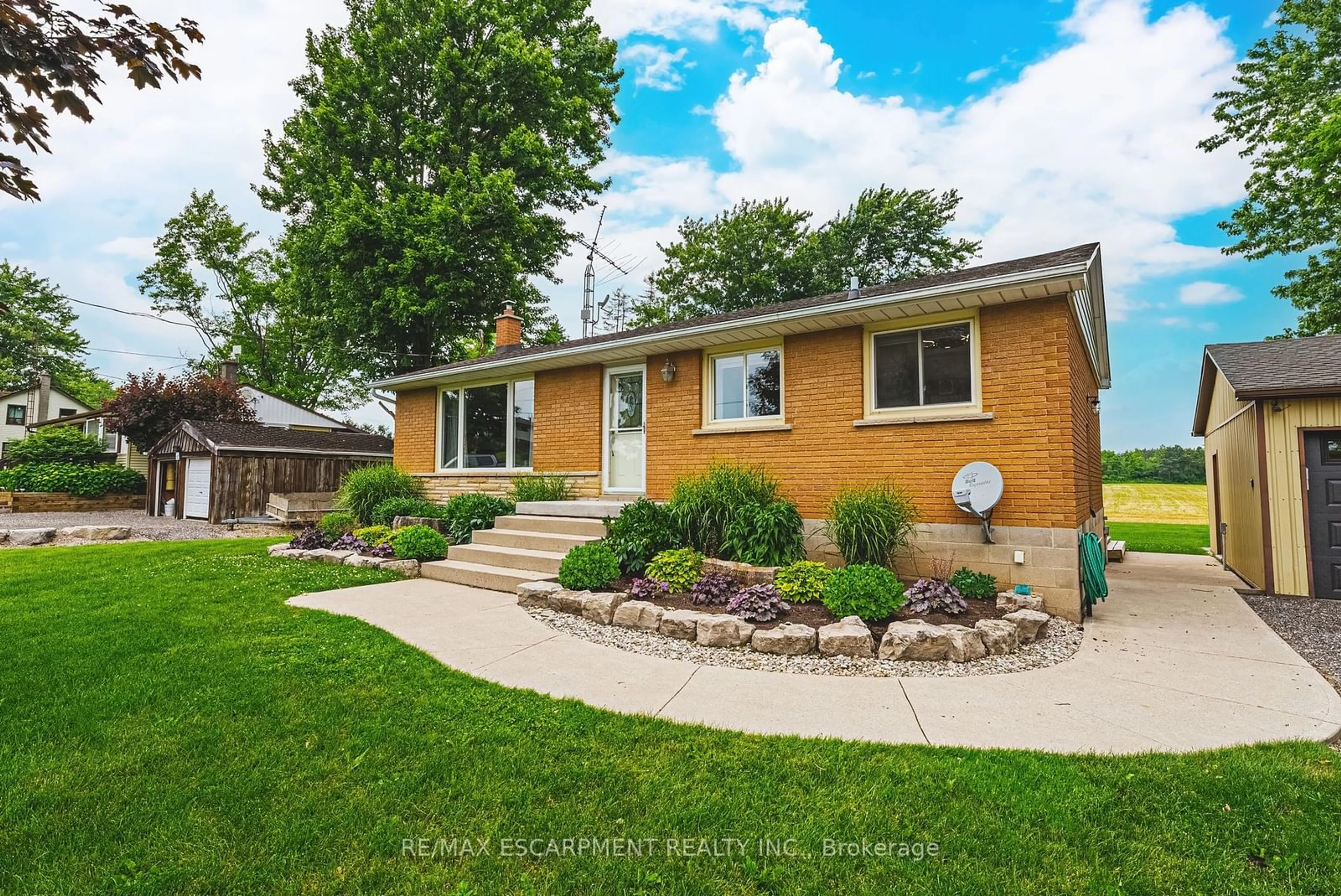 Frontside or backside of a home, the fenced backyard for 1451 6th Con Rd, Hamilton Ontario N0B 1L0