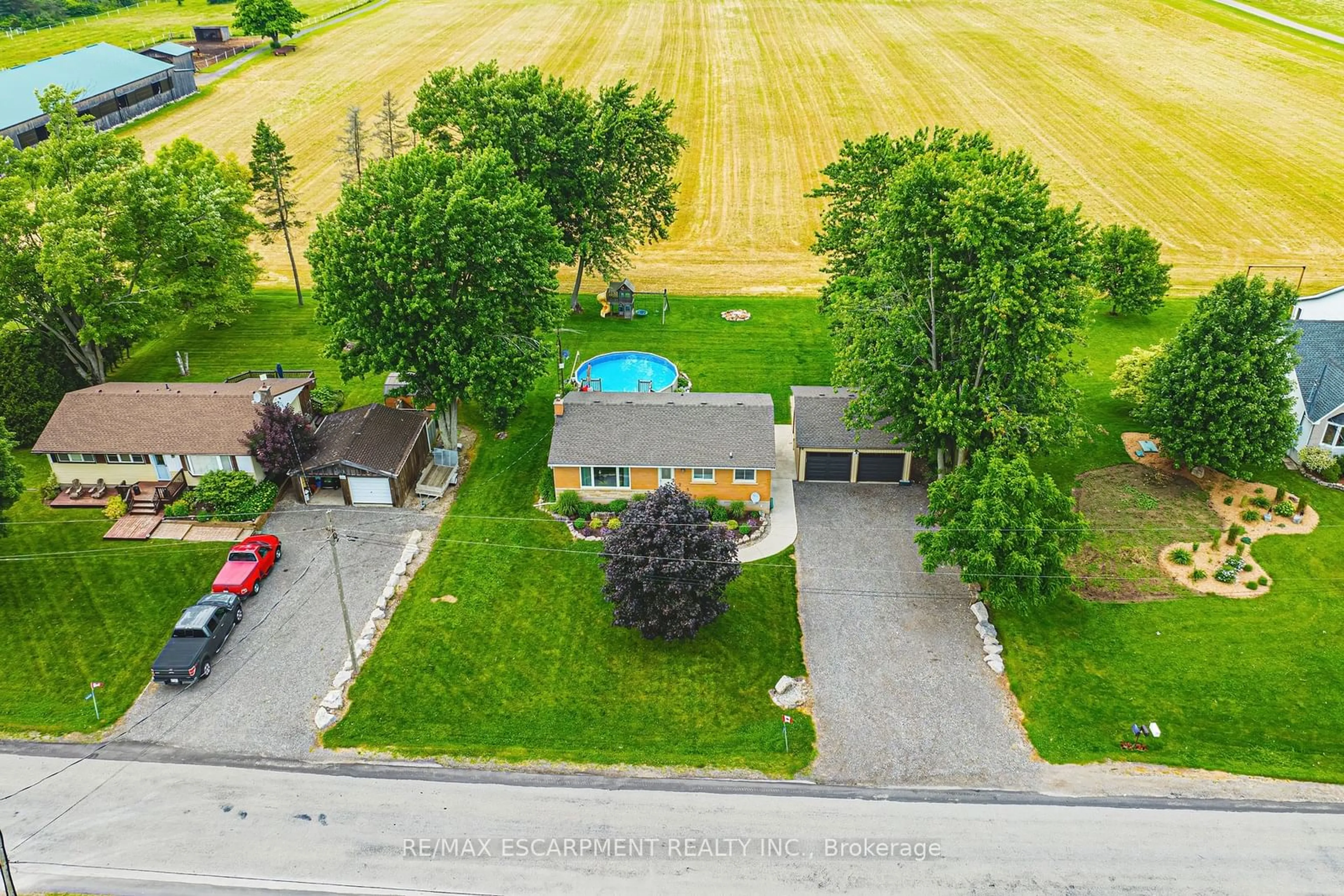 Frontside or backside of a home, the fenced backyard for 1451 6th Con Rd, Hamilton Ontario N0B 1L0