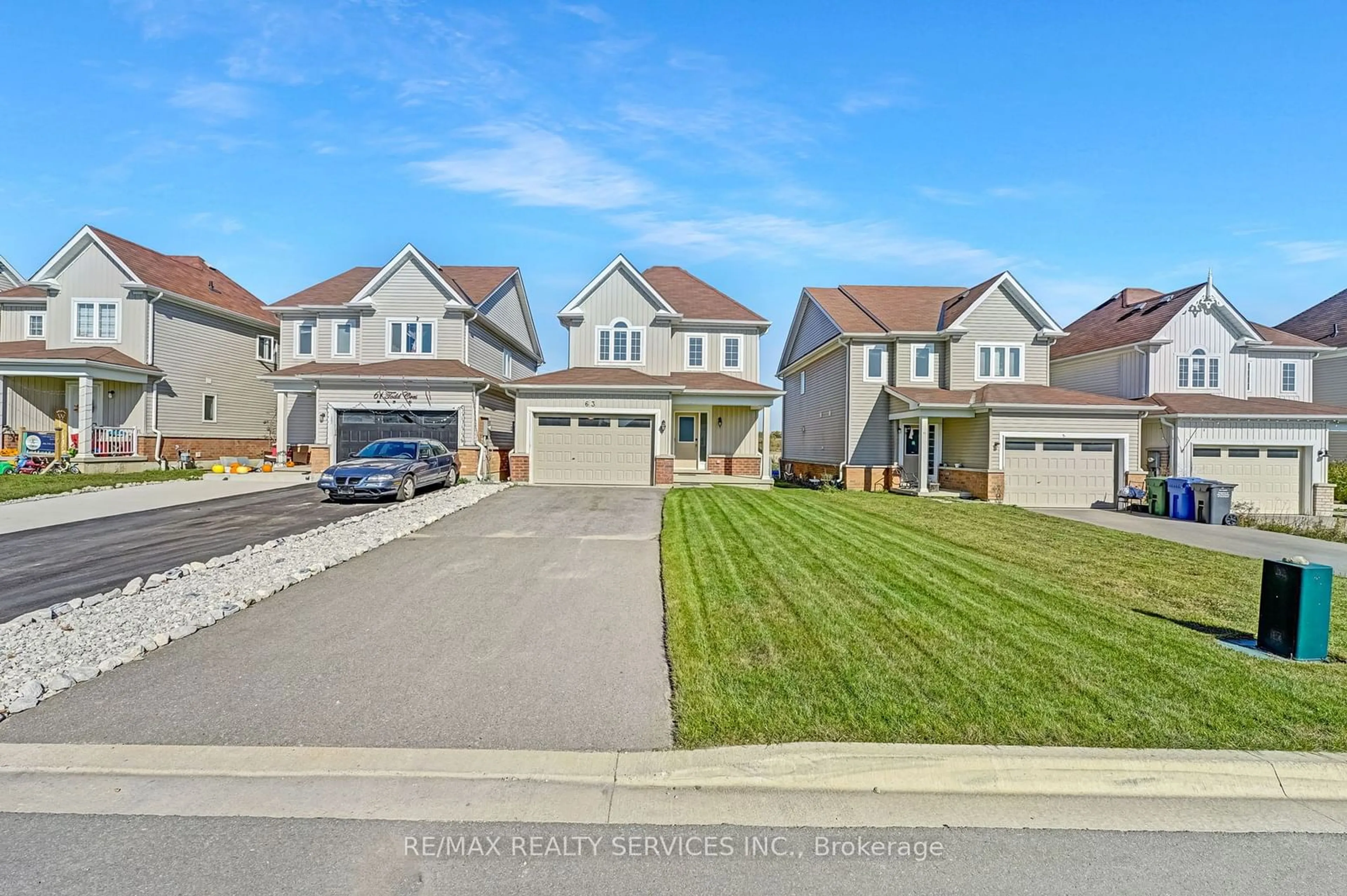 Frontside or backside of a home, the street view for 63 Todd Cres, Southgate Ontario N0C 1B0