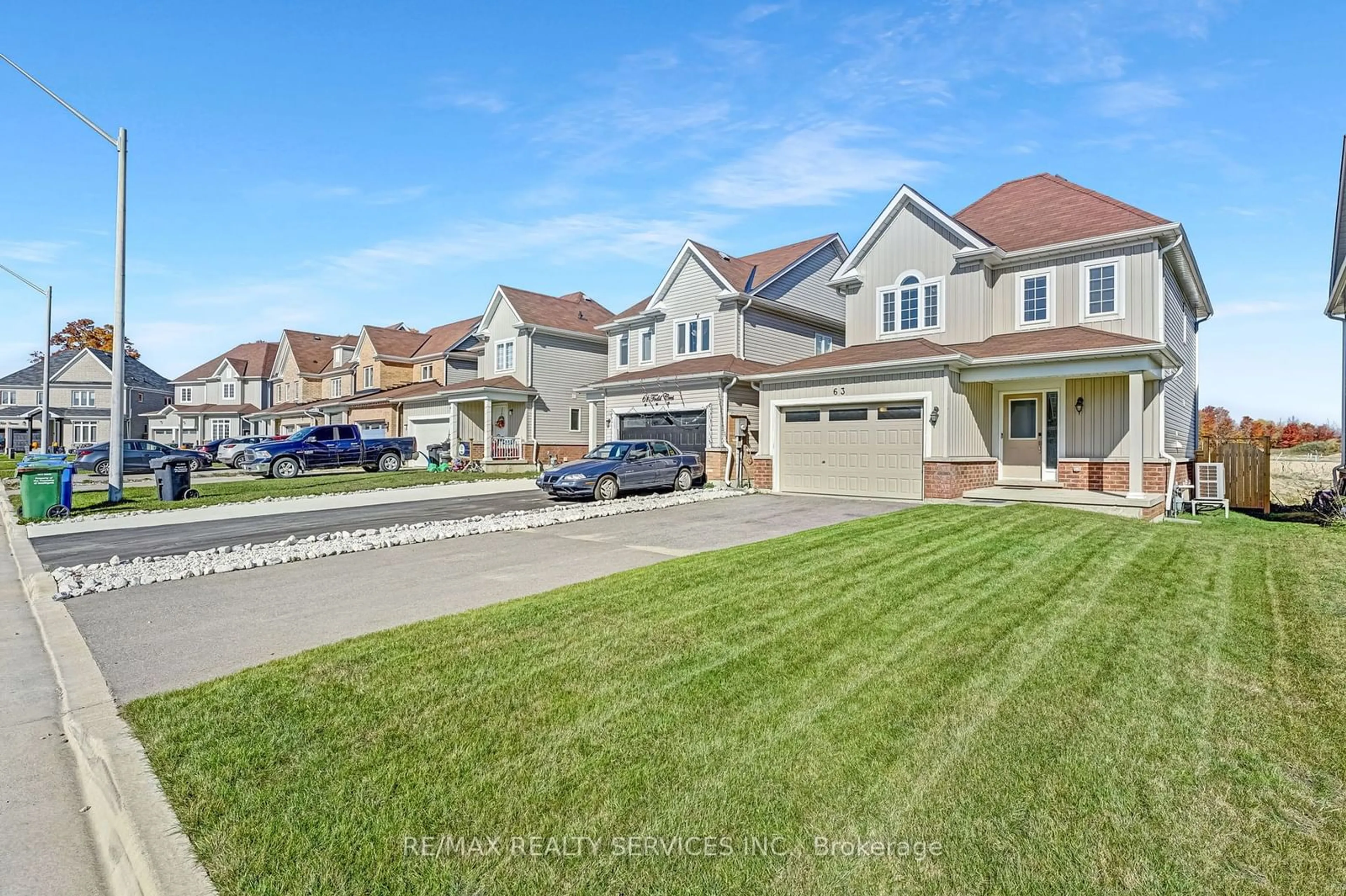 Frontside or backside of a home, the street view for 63 Todd Cres, Southgate Ontario N0C 1B0