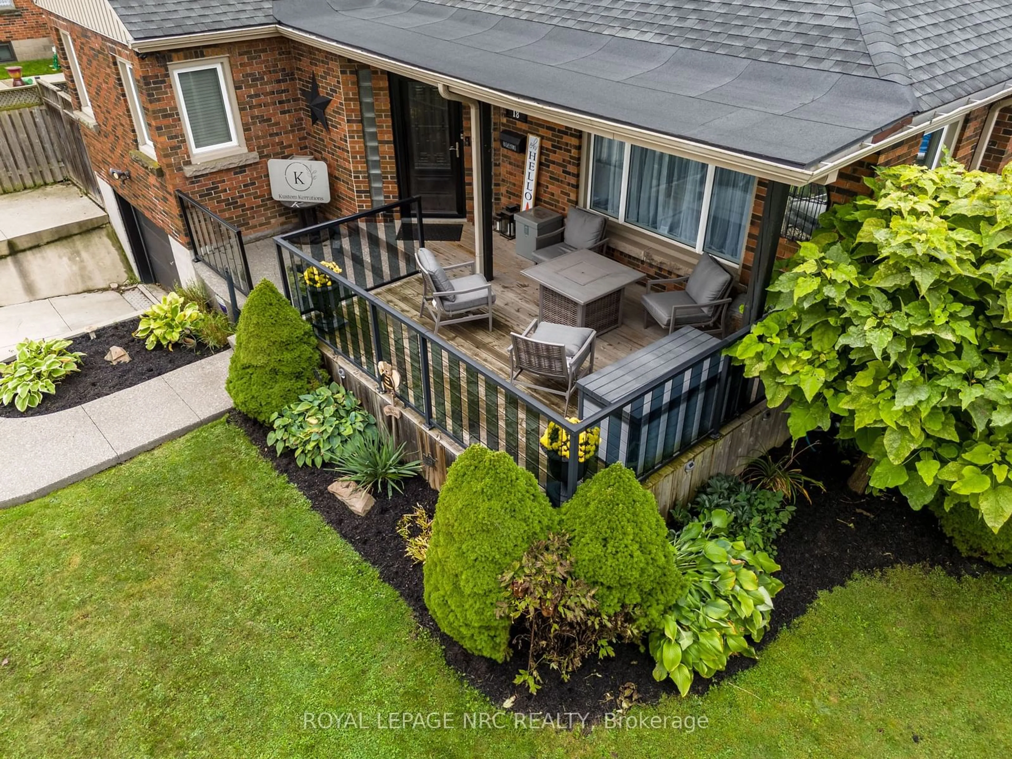 Frontside or backside of a home, the fenced backyard for 18 Irving Pl, Hamilton Ontario L8T 3R3