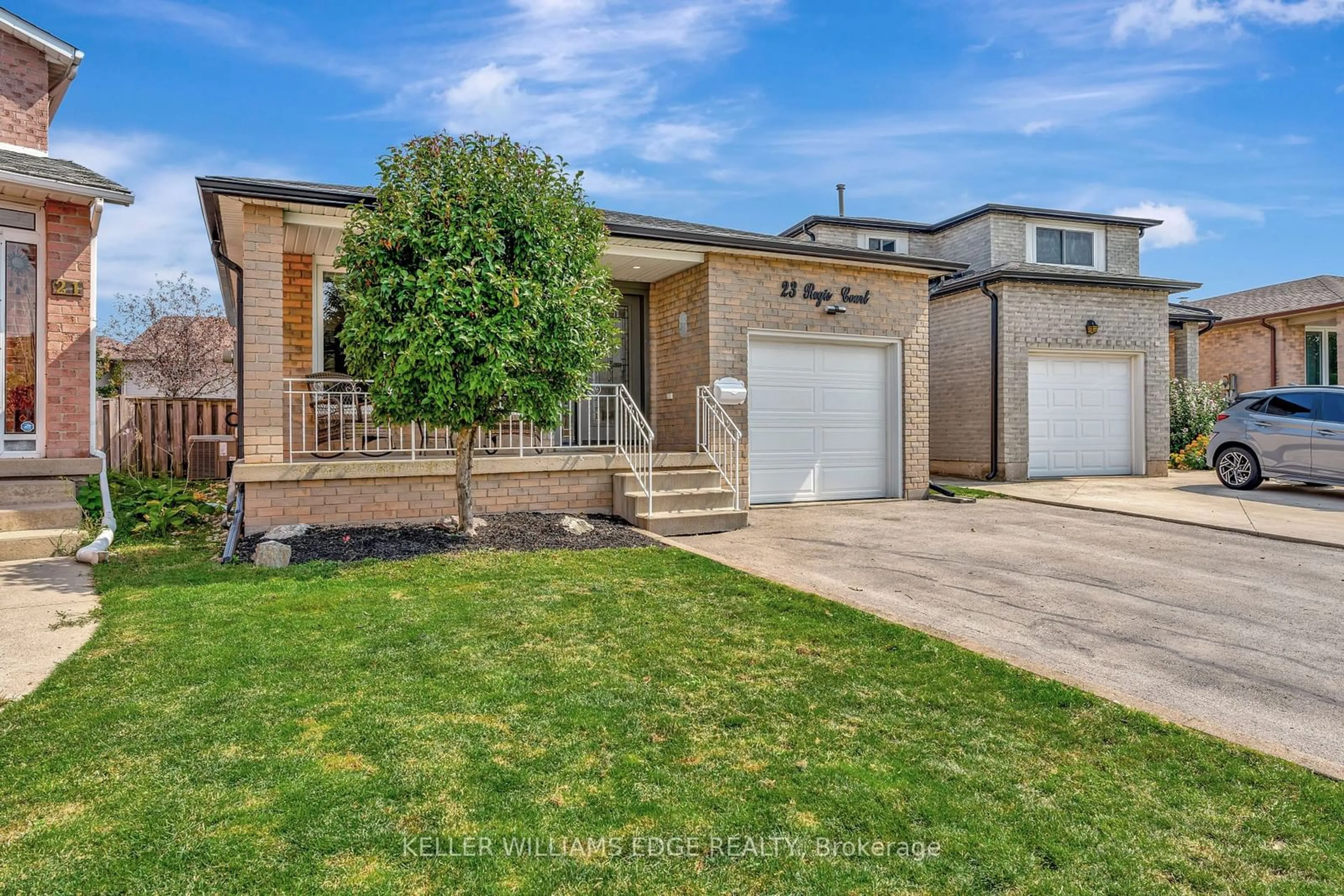 Frontside or backside of a home, the fenced backyard for 23 Regis Crt, Hamilton Ontario L8E 4M8