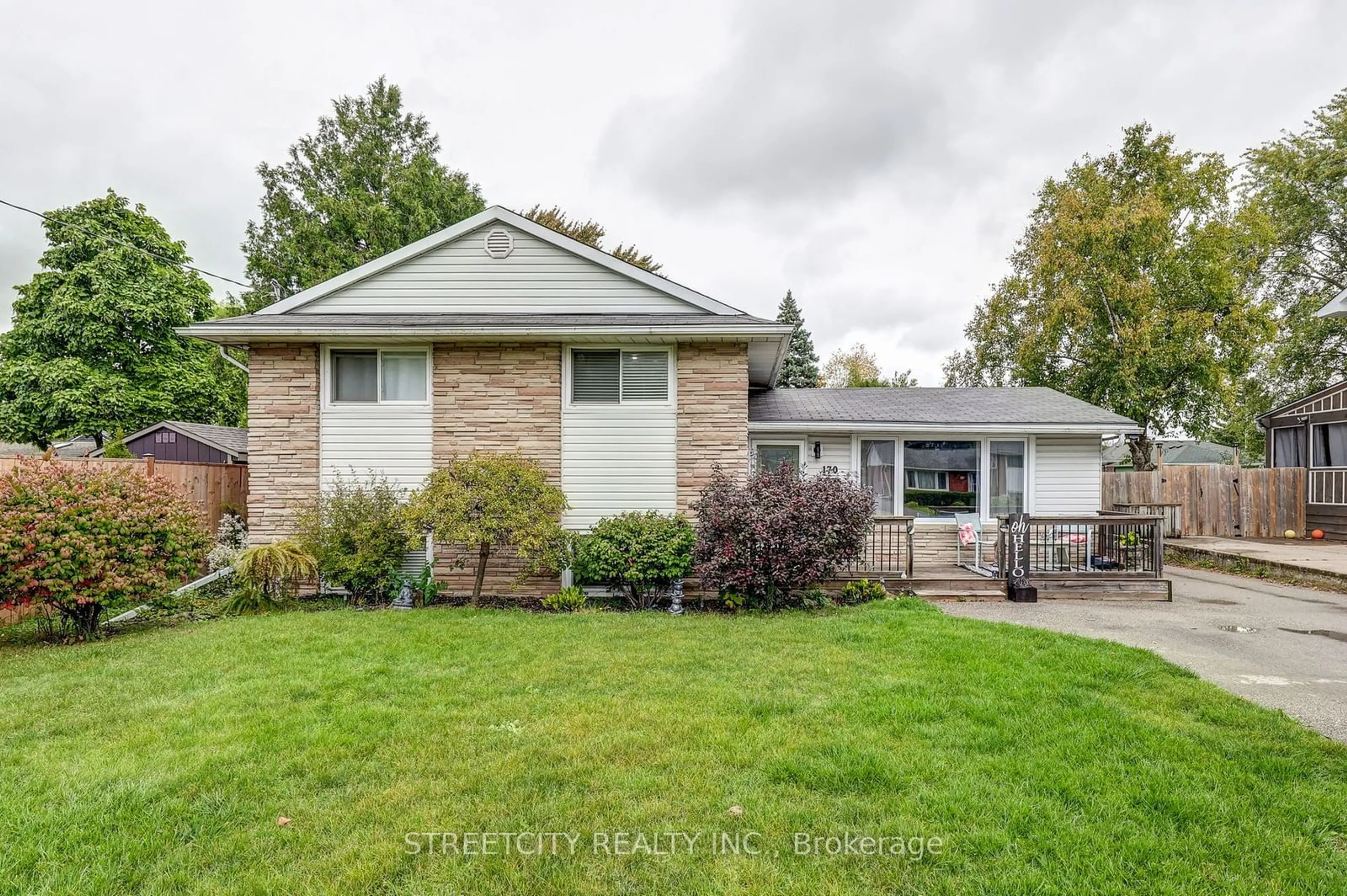 Frontside or backside of a home, the fenced backyard for 170 Locust St, St. Thomas Ontario N5R 2C9