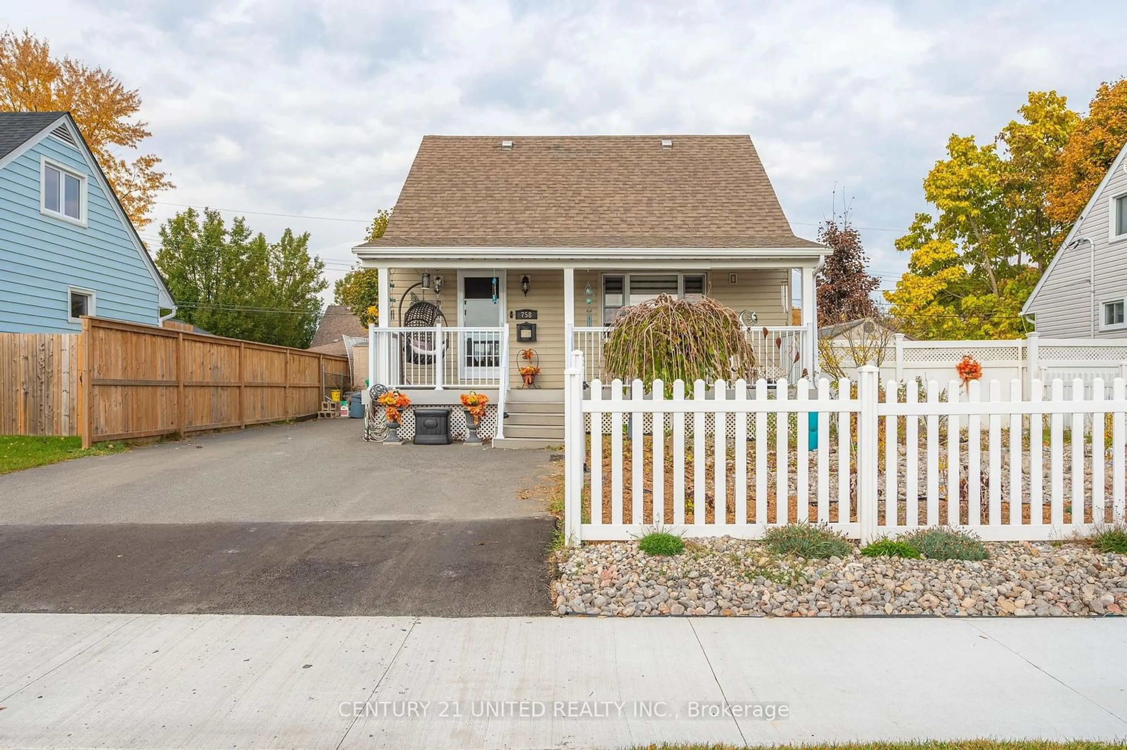 Frontside or backside of a home, the fenced backyard for 758 Gillespie Ave, Peterborough Ontario K9J 4B7