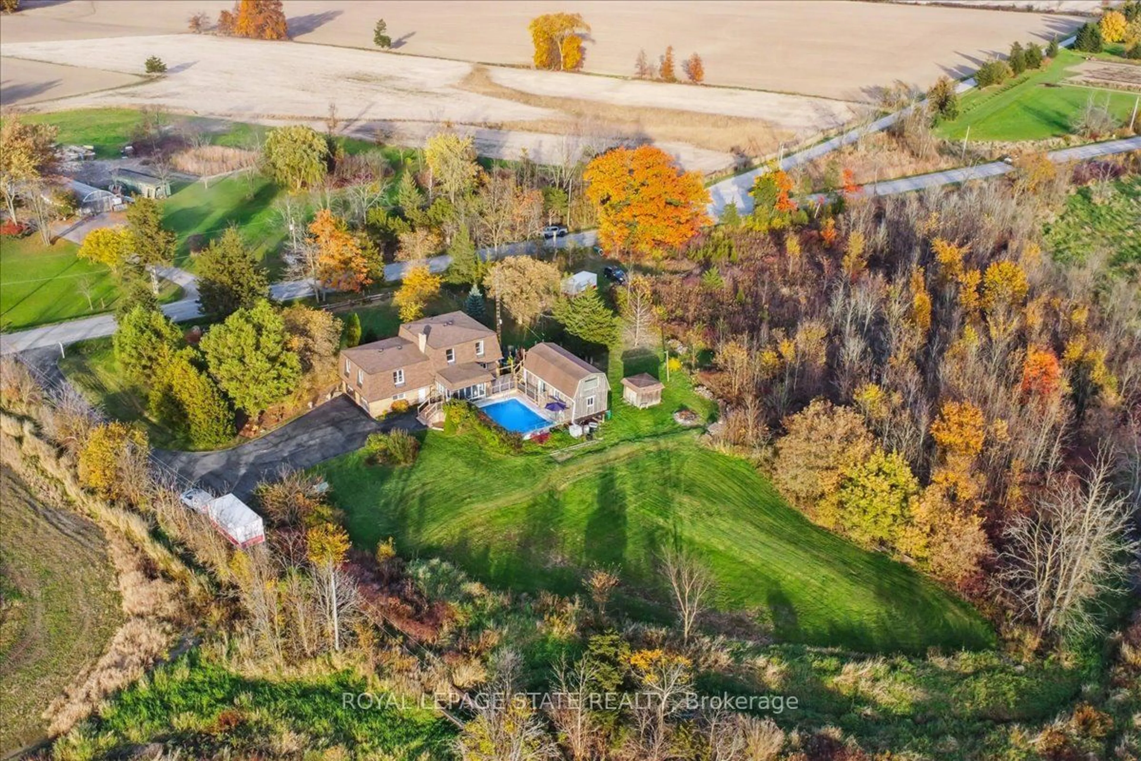 A pic from exterior of the house or condo, the fenced backyard for 7956 Twenty Rd, West Lincoln Ontario L0R 2A0