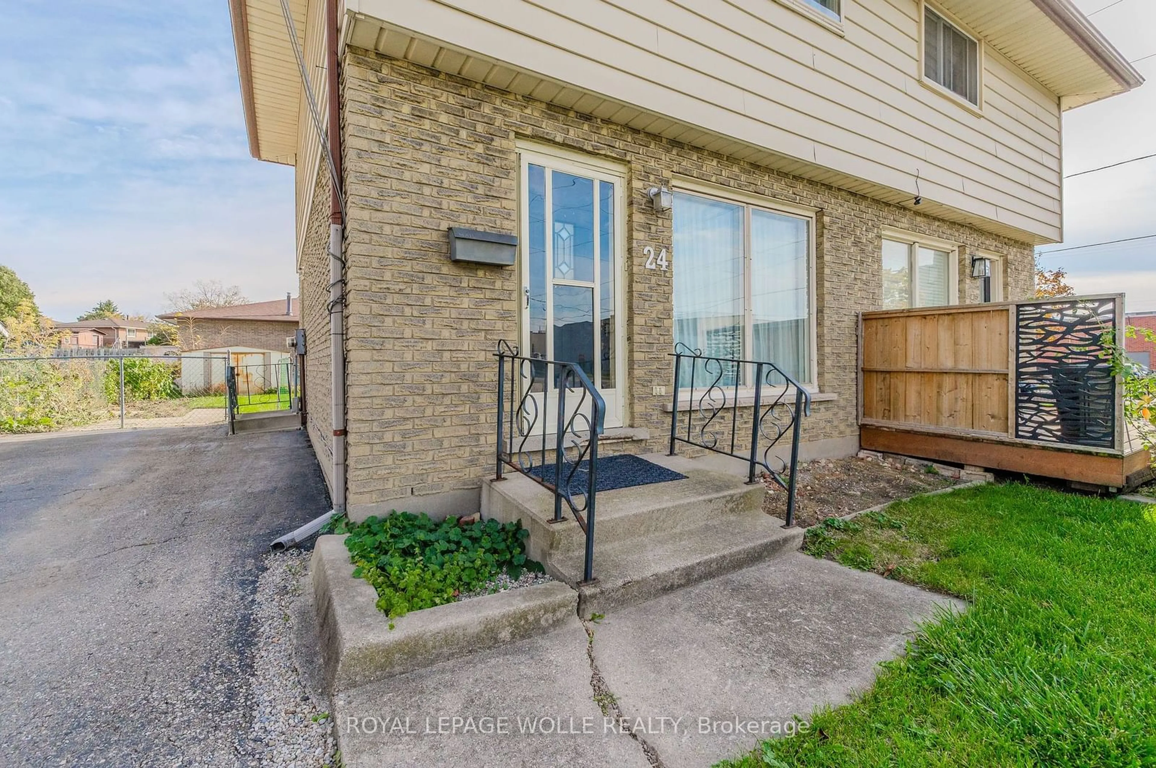 A pic from exterior of the house or condo, the fenced backyard for 24 Clarke St, Woodstock Ontario N4S 7M5